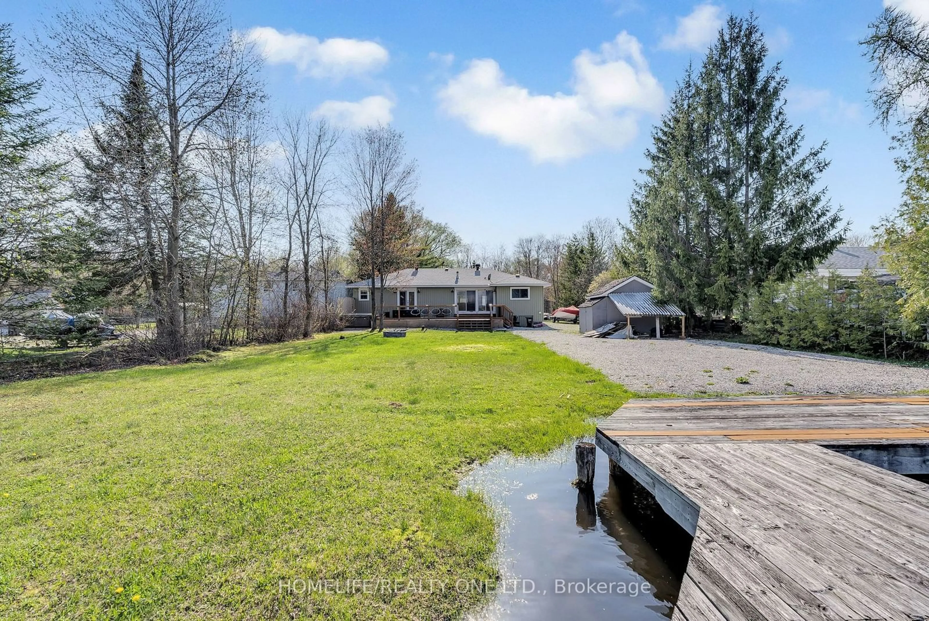 Frontside or backside of a home, the fenced backyard for 4055 Glen Cedar Dr, Ramara Ontario L3V 6H7