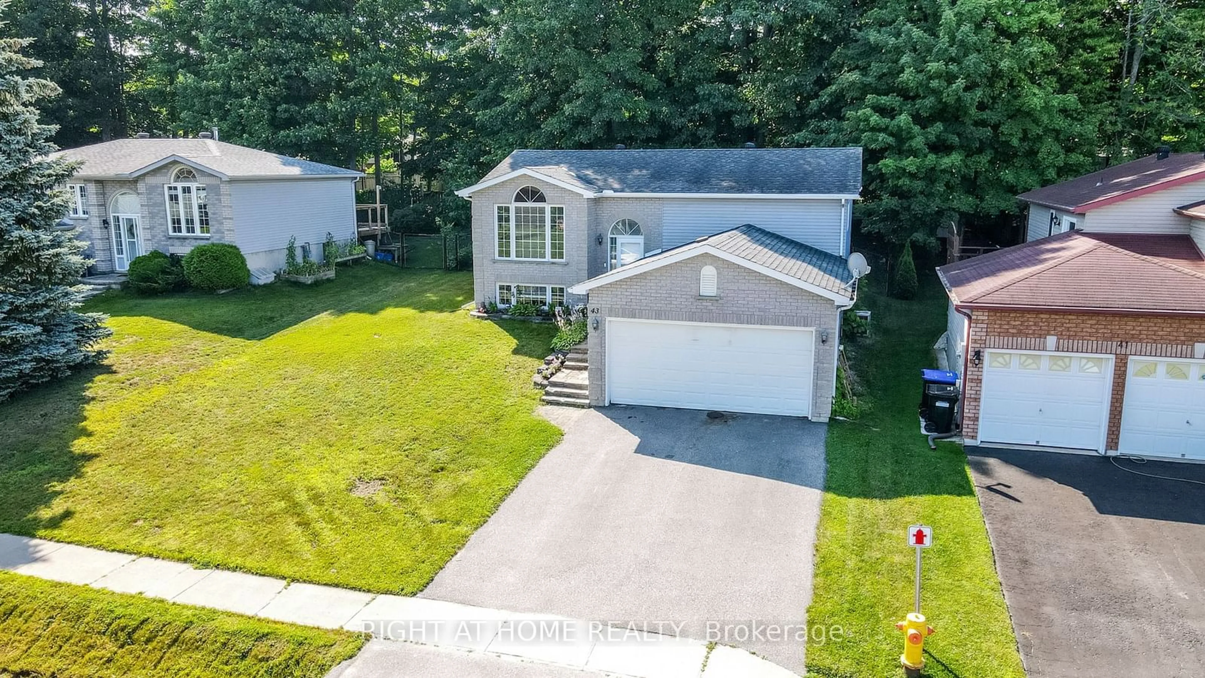 Frontside or backside of a home, the fenced backyard for 43 Mcdermitt Tr, Tay Ontario L0K 2A0