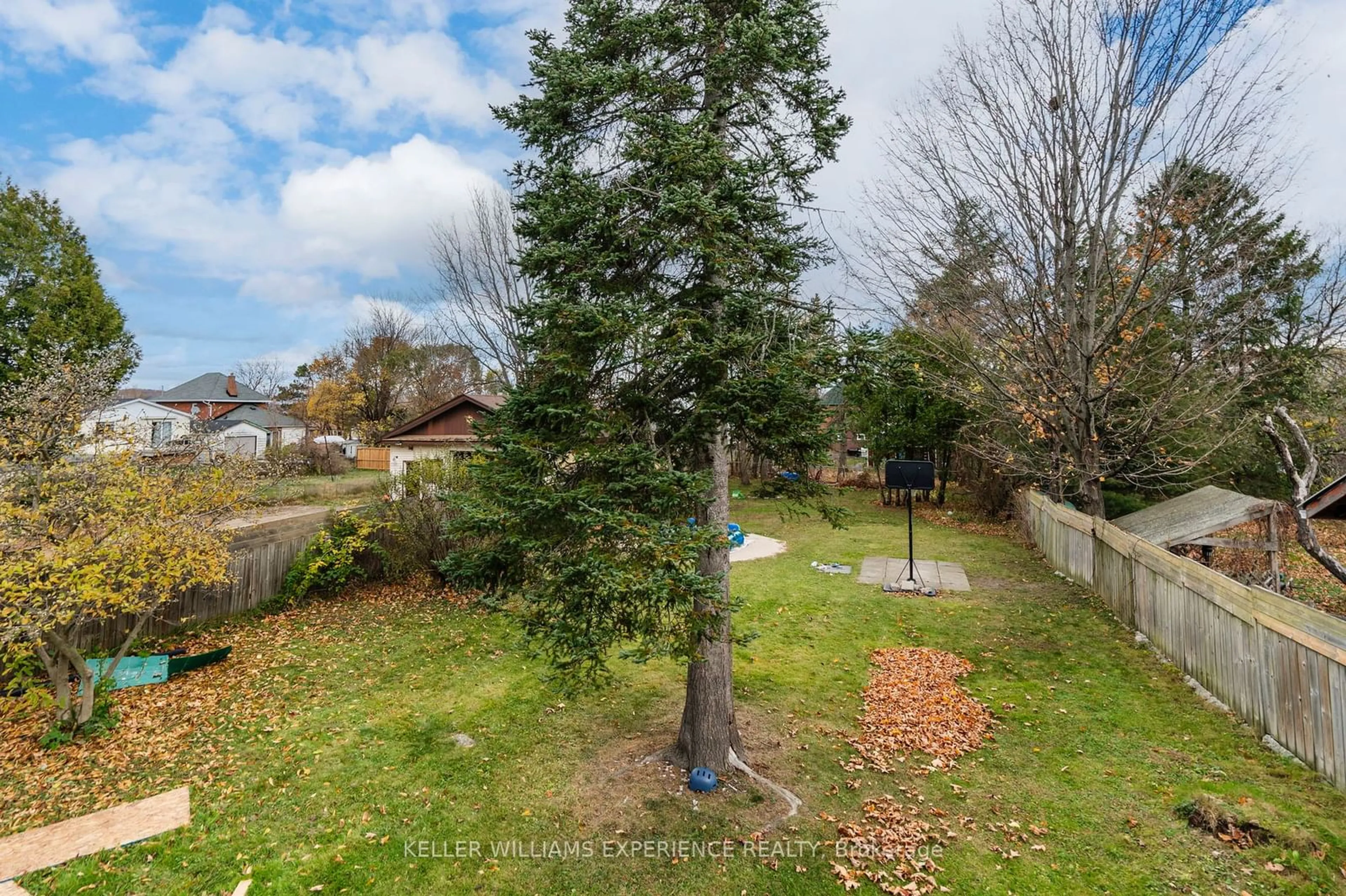 Frontside or backside of a home, the fenced backyard for 95 Fifth St, Midland Ontario L4R 3V6