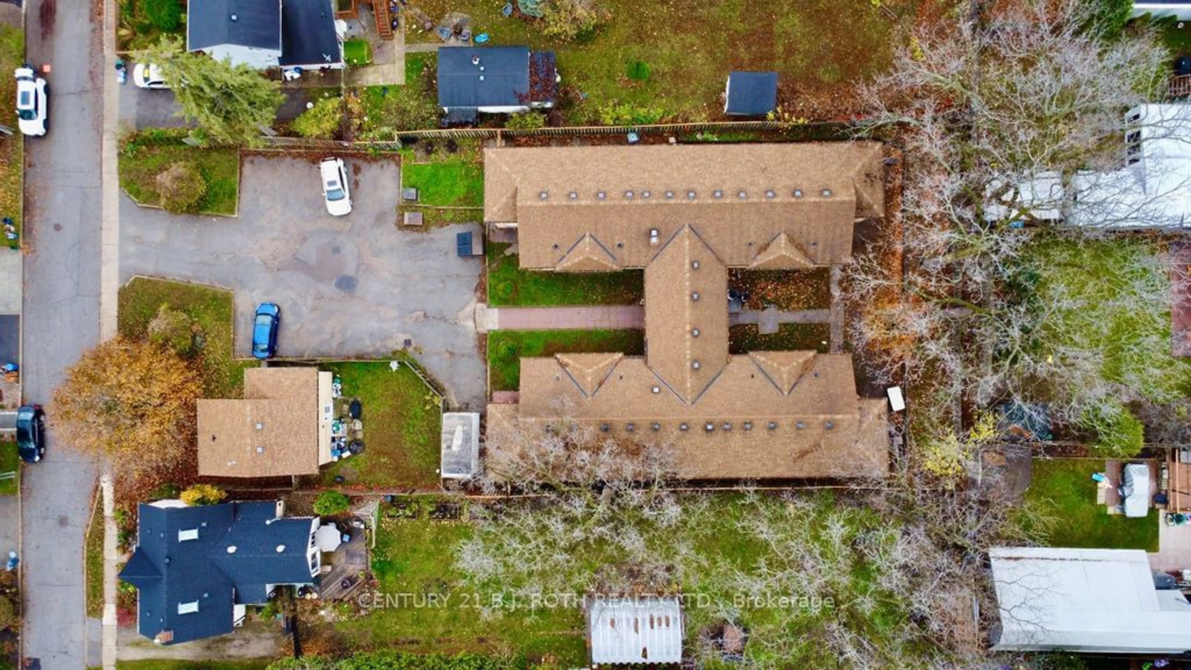 Frontside or backside of a home, the fenced backyard for 24 North St, Barrie Ontario L4M 2R9