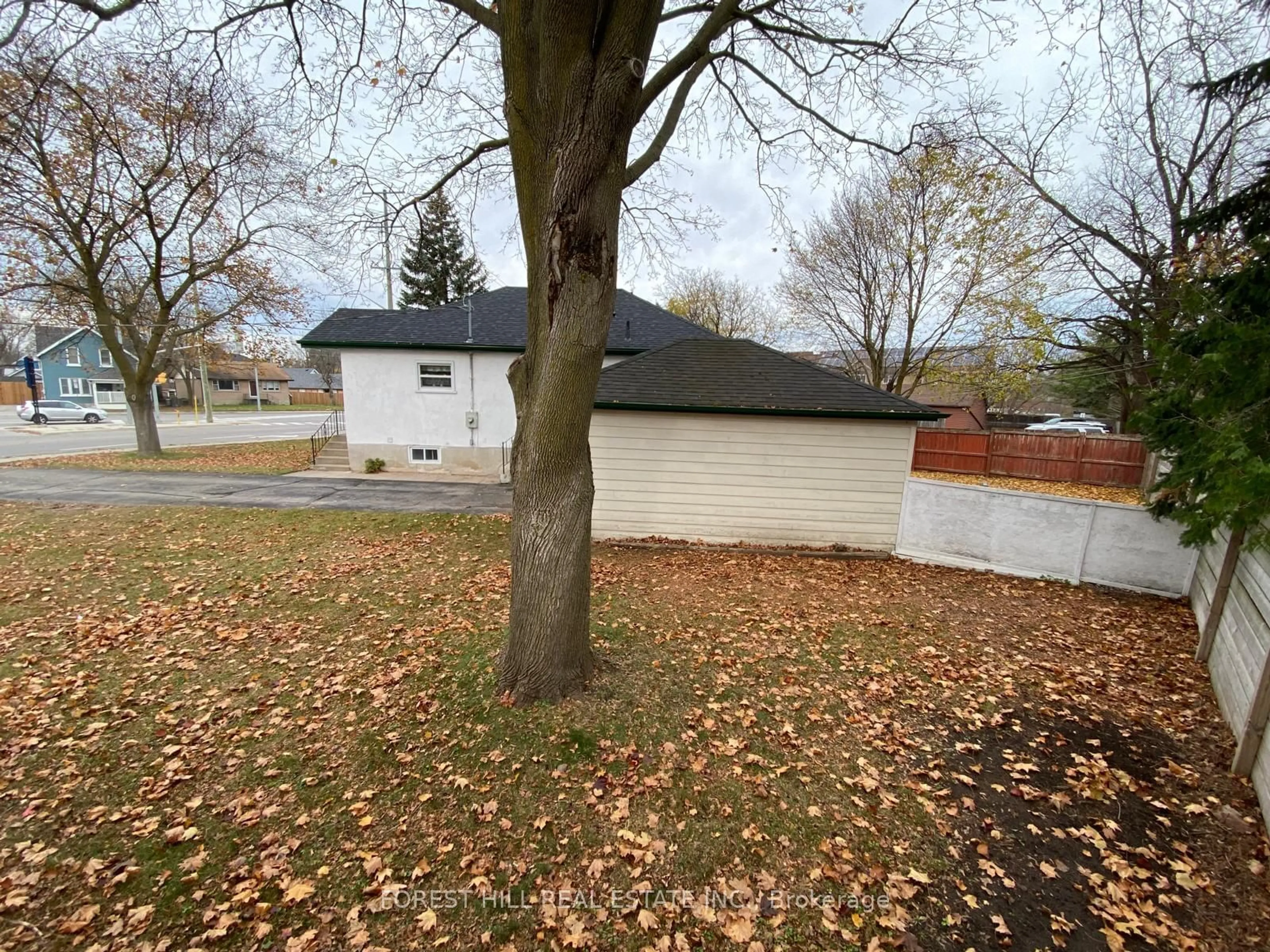 Frontside or backside of a home, the fenced backyard for 321 Innisfil St, Barrie Ontario L4N 3G4