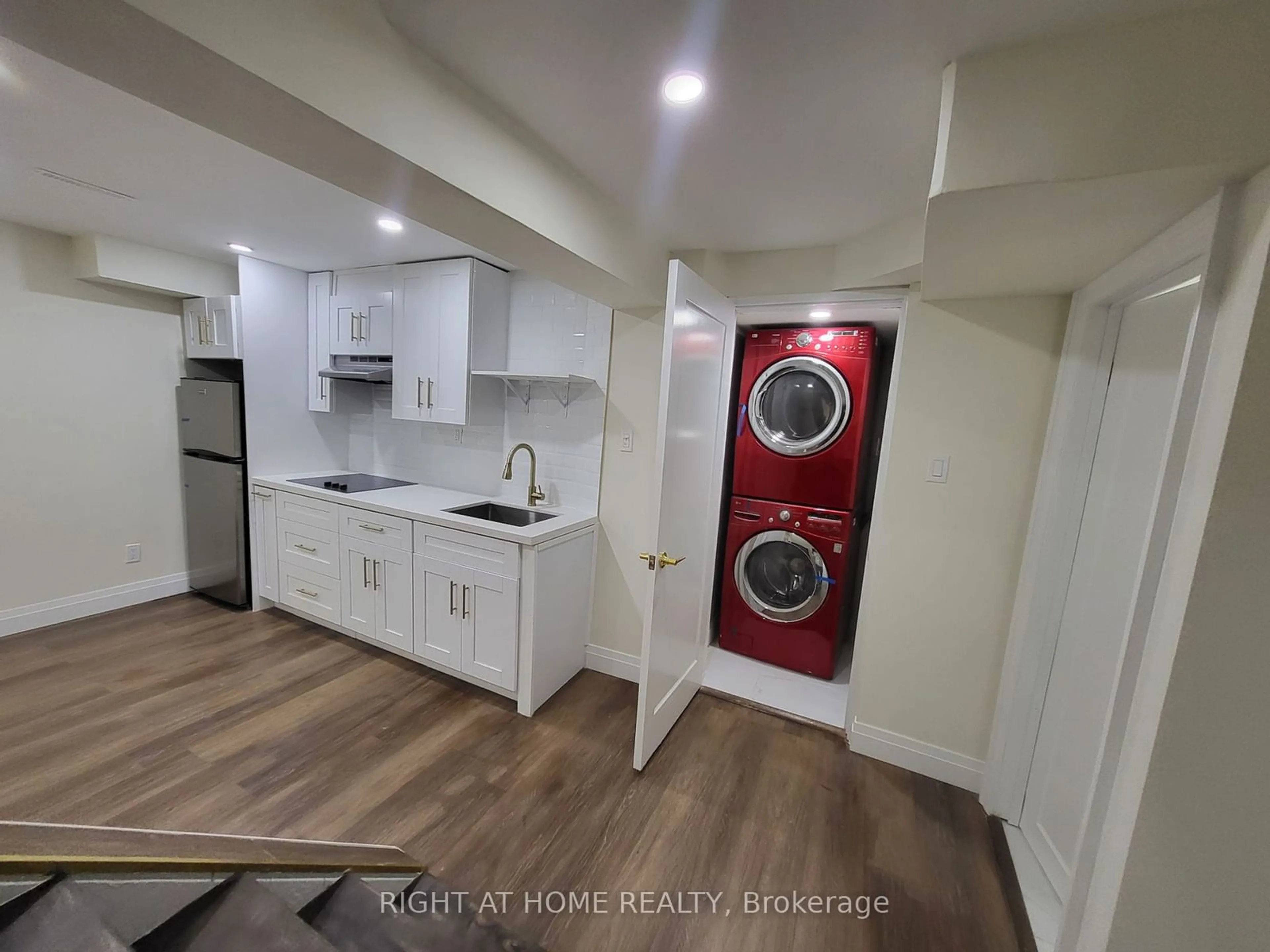 Kitchen with laundary machines, unknown floor for 247 Hickling Tr, Barrie Ontario L4M 5W9