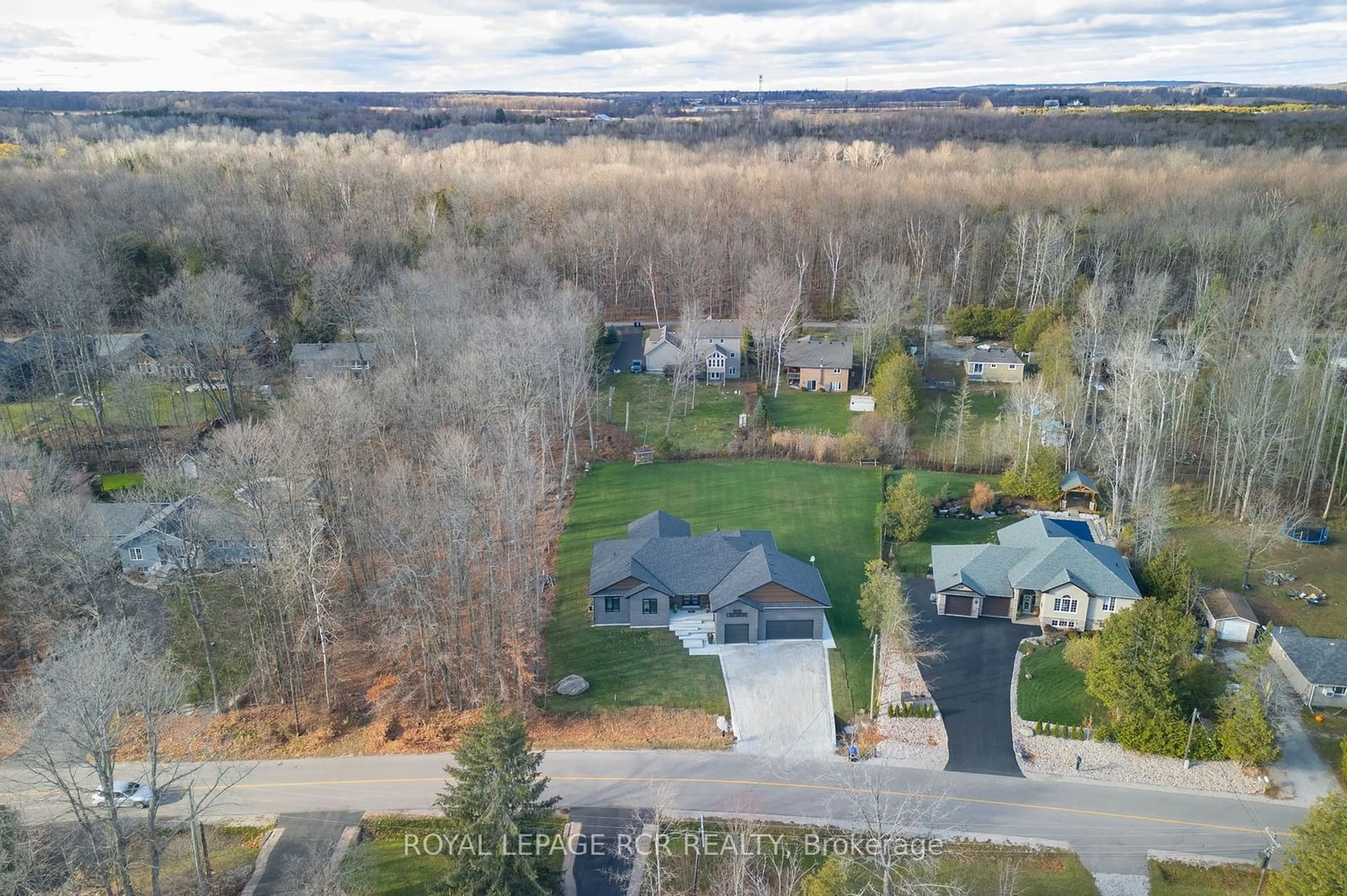 Frontside or backside of a home, the street view for 1016 Lakeshore Dr, Oro-Medonte Ontario L0L 1T0