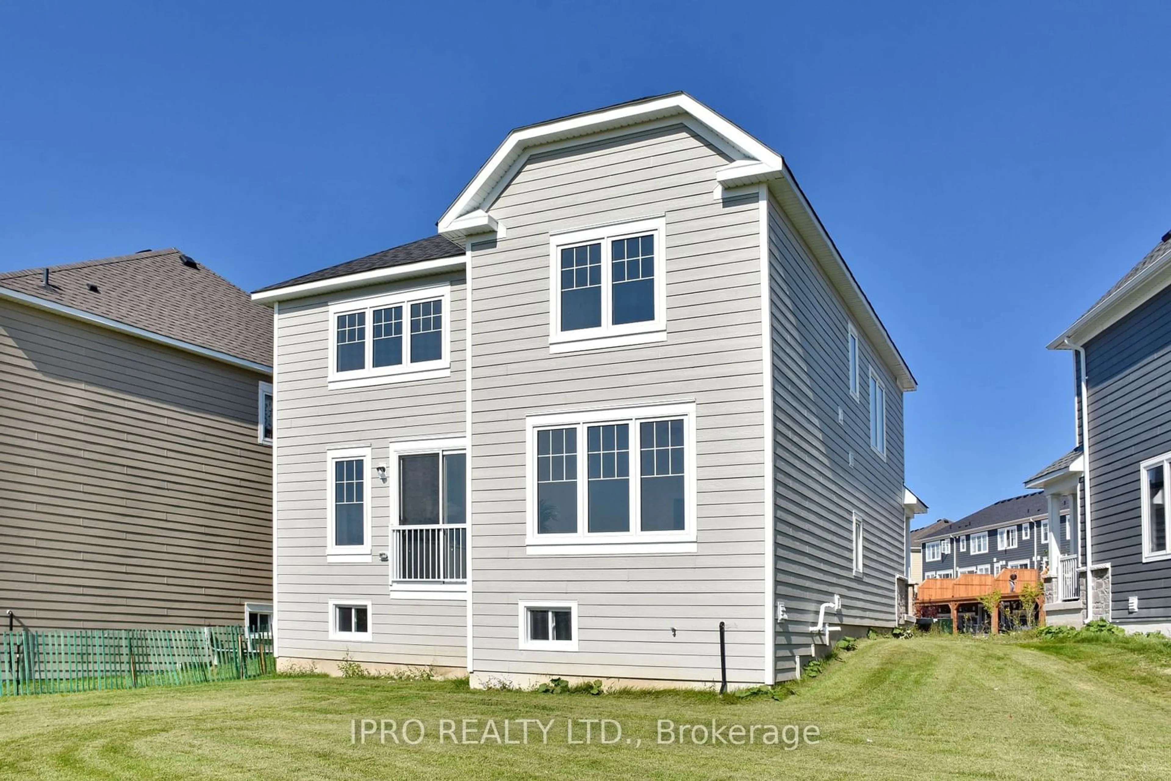 A pic from exterior of the house or condo, the fenced backyard for 12 Shapira Ave, Wasaga Beach Ontario L9Z 0K2