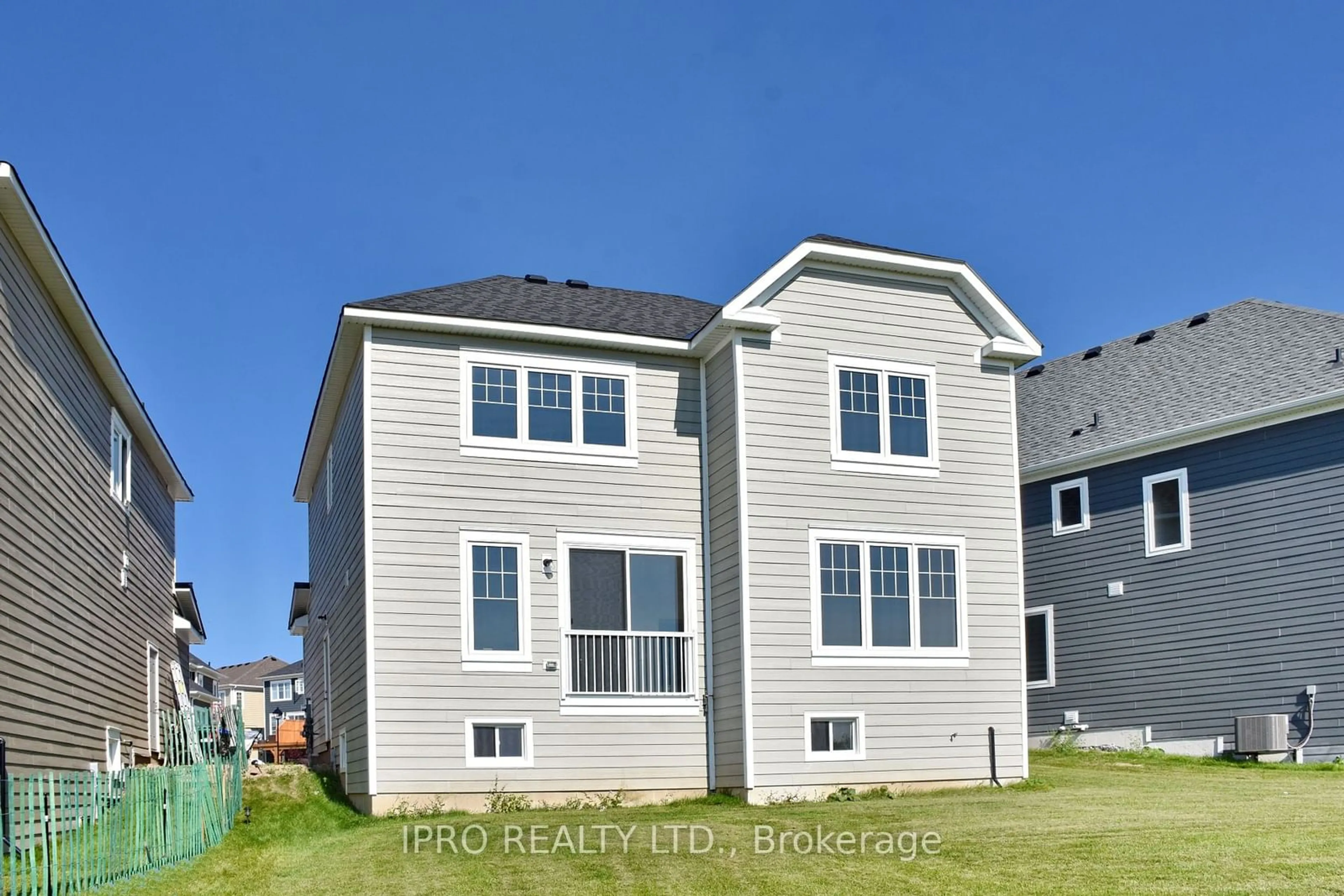 Frontside or backside of a home, the fenced backyard for 12 Shapira Ave, Wasaga Beach Ontario L9Z 0K2