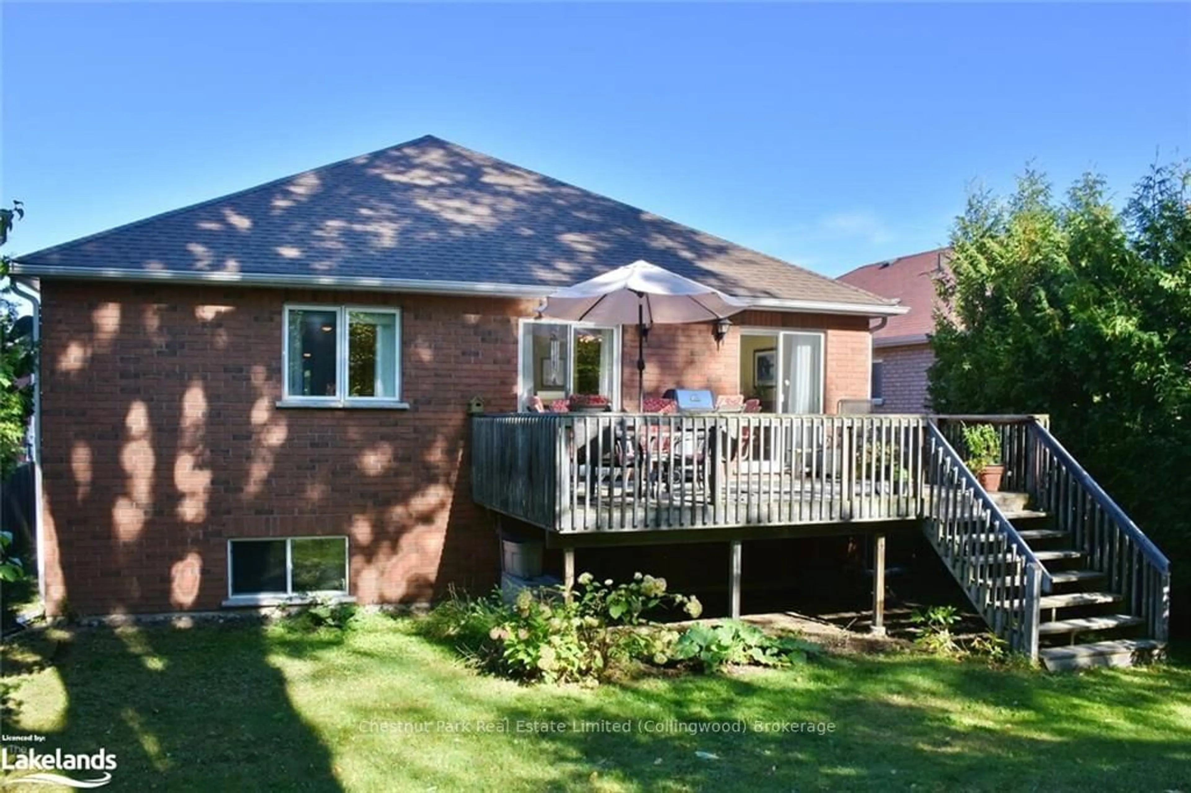 Frontside or backside of a home, the fenced backyard for 13 TONA Tr, Wasaga Beach Ontario L9Z 0A5