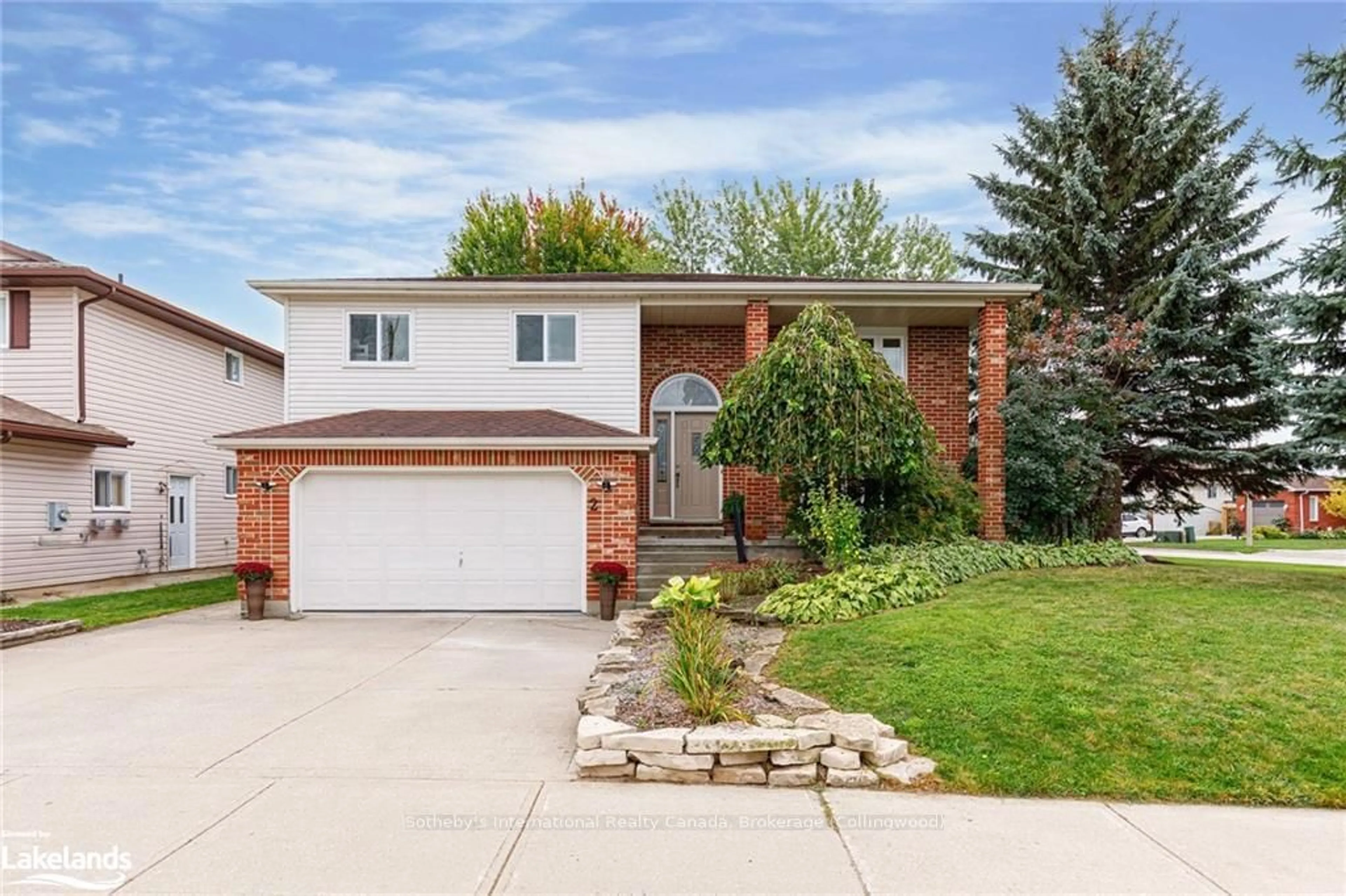 Frontside or backside of a home, the fenced backyard for 2 BUSH St, Collingwood Ontario L9Y 4S9