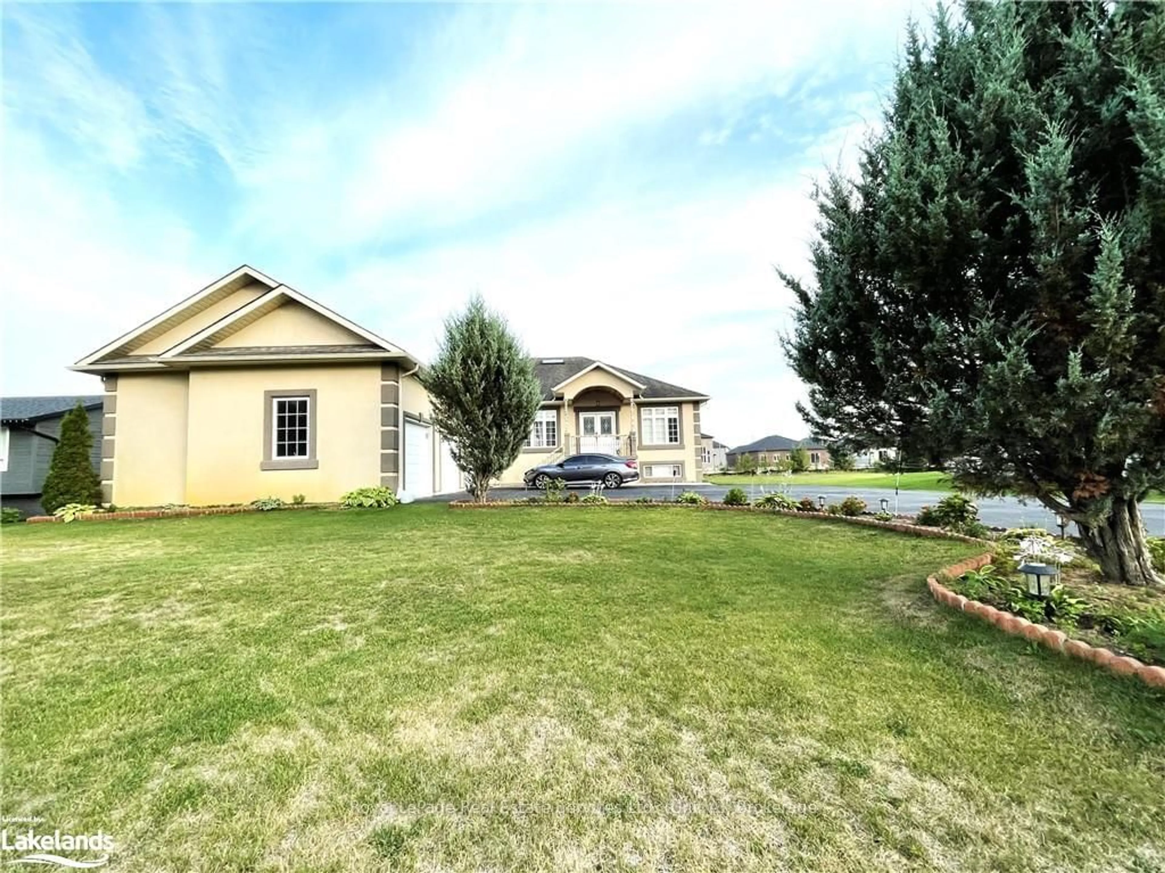 Frontside or backside of a home, the fenced backyard for 16 WASAGA SANDS Dr, Wasaga Beach Ontario L9Z 1J6