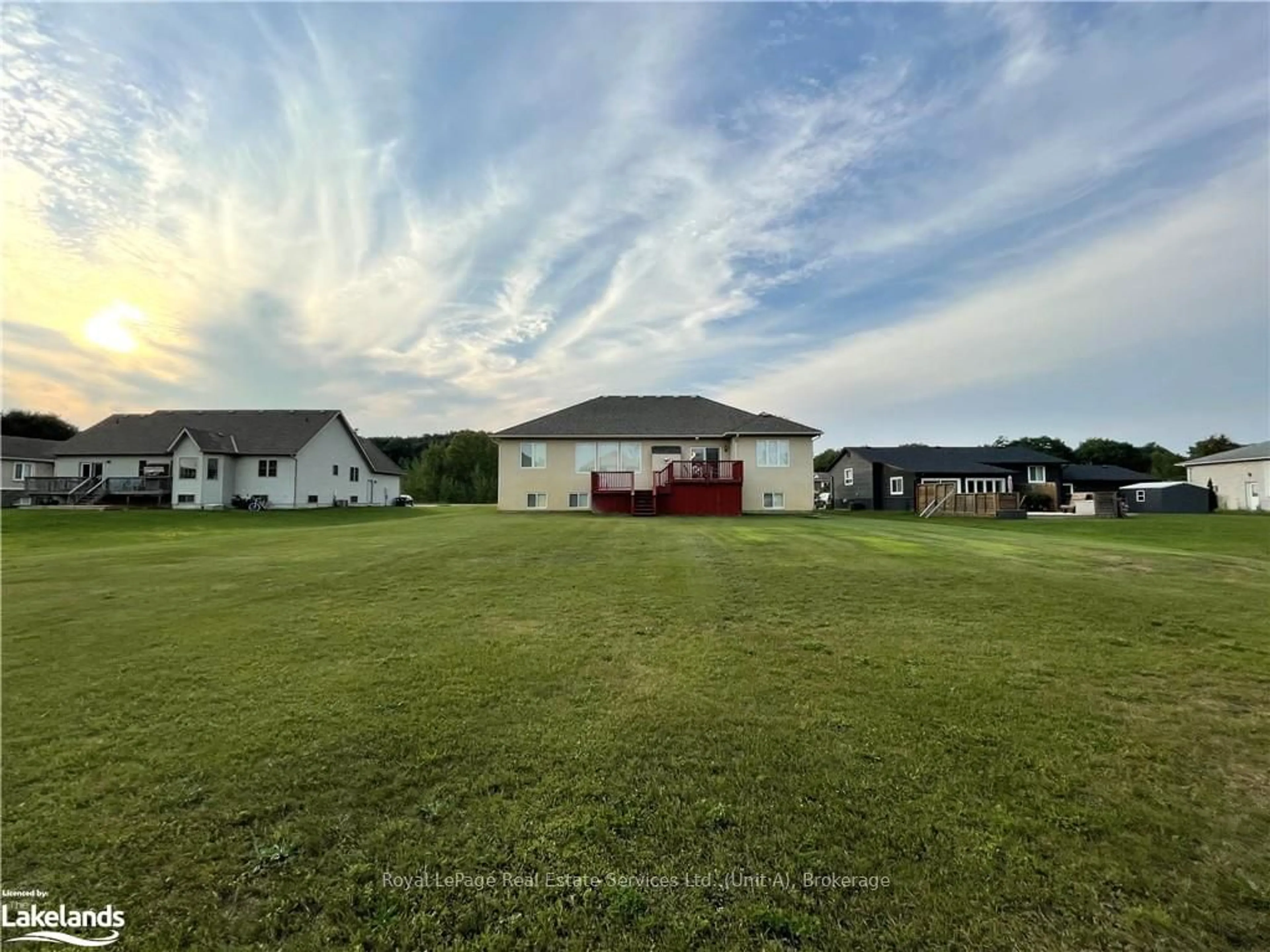 Frontside or backside of a home, the fenced backyard for 16 WASAGA SANDS Dr, Wasaga Beach Ontario L9Z 1J6