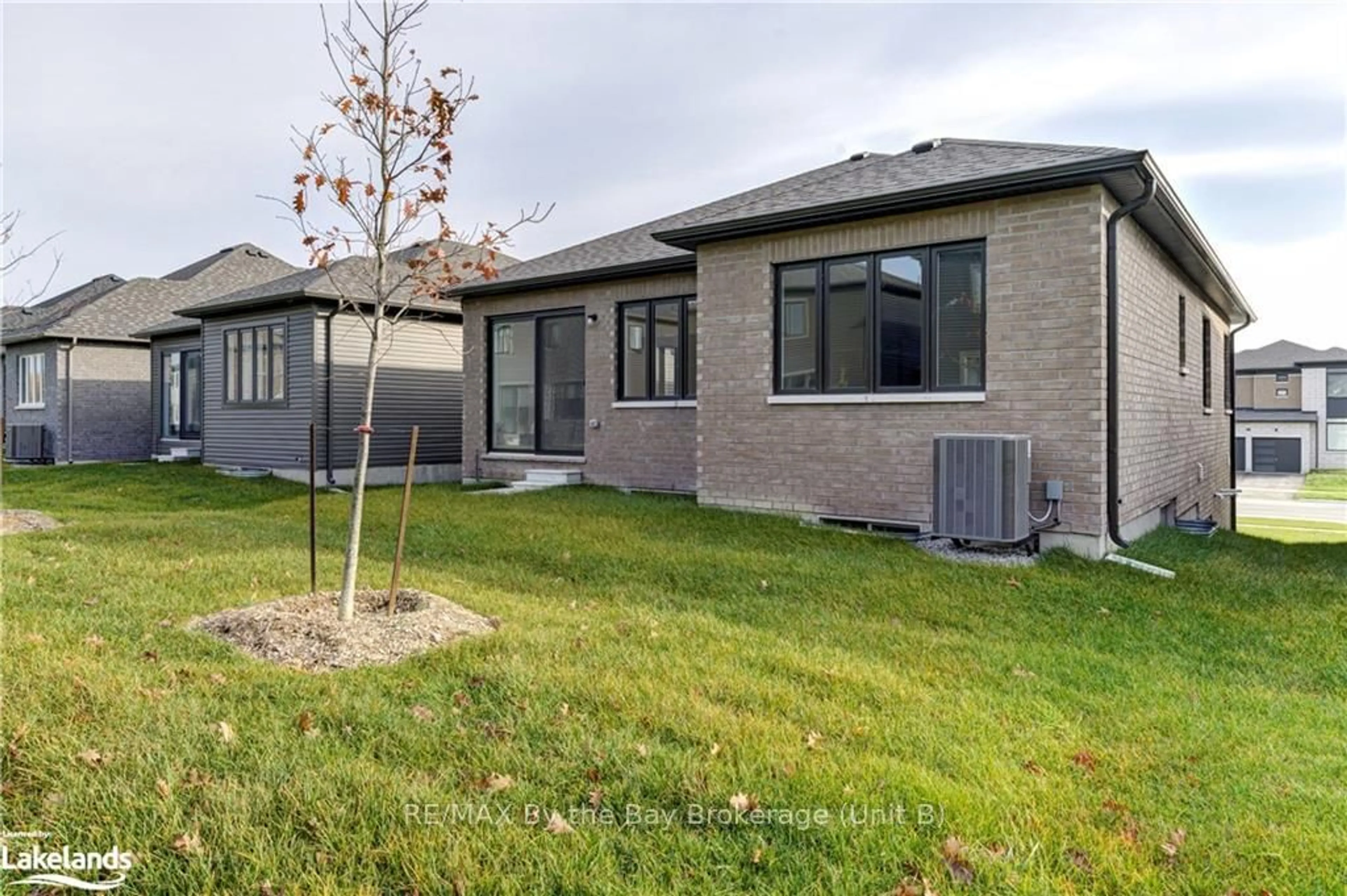 Frontside or backside of a home, the fenced backyard for 77 SUN VALLEY Ave, Wasaga Beach Ontario L9Z 0N8