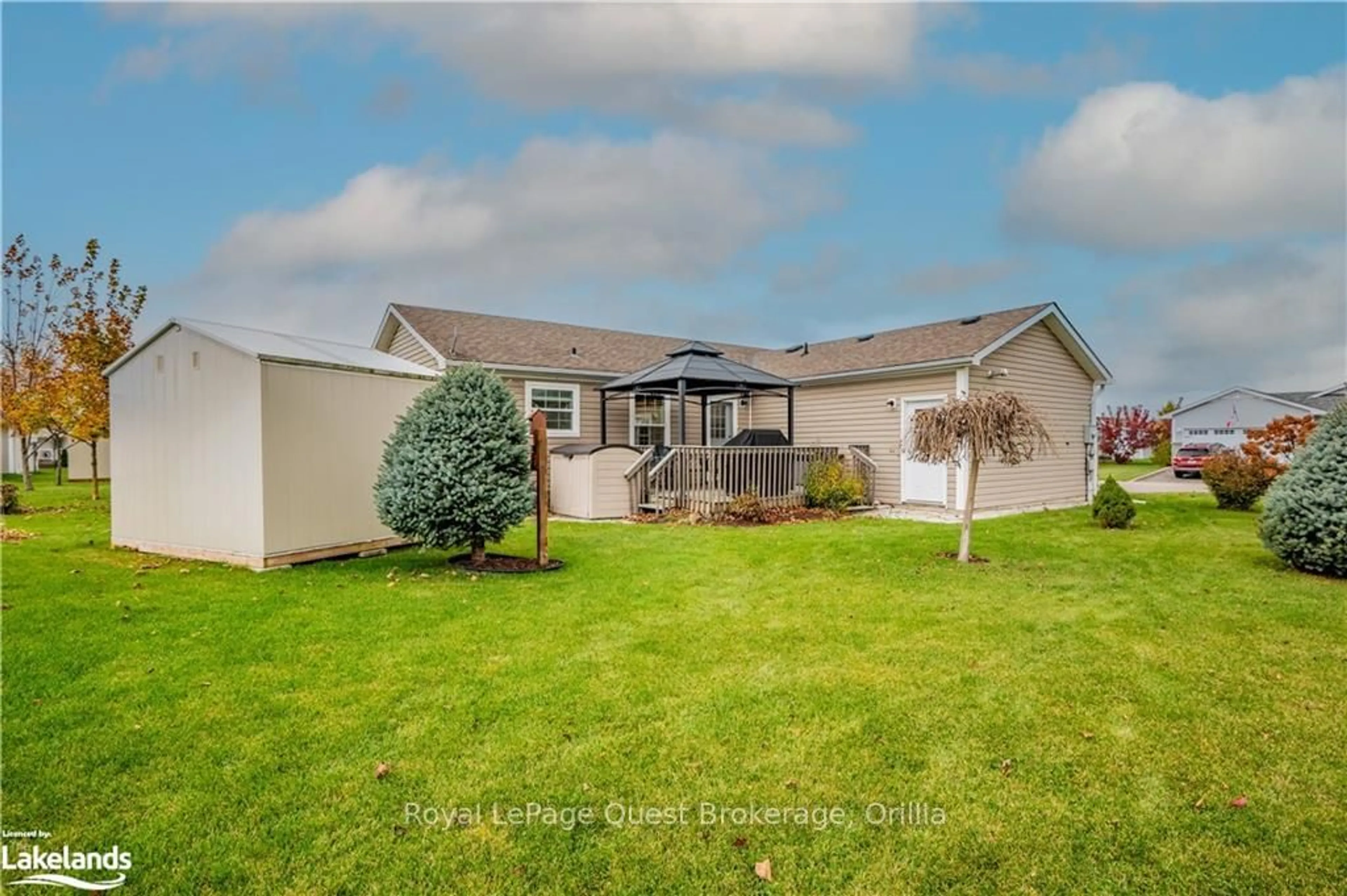 Frontside or backside of a home, the fenced backyard for 13 MARVIN GARDENS Blvd, Wasaga Beach Ontario L9Z 3A8