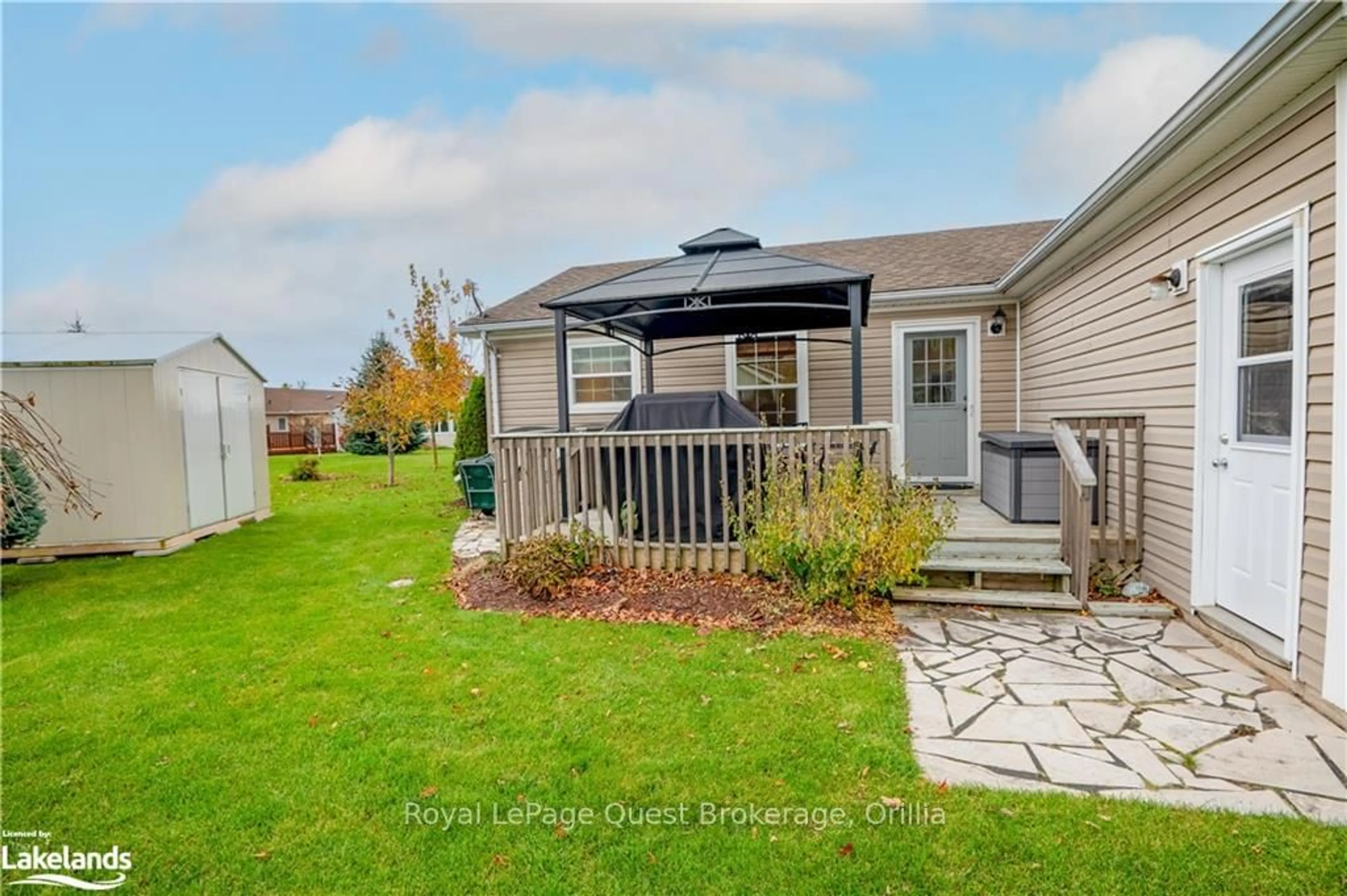 Frontside or backside of a home, the fenced backyard for 13 MARVIN GARDENS Blvd, Wasaga Beach Ontario L9Z 3A8