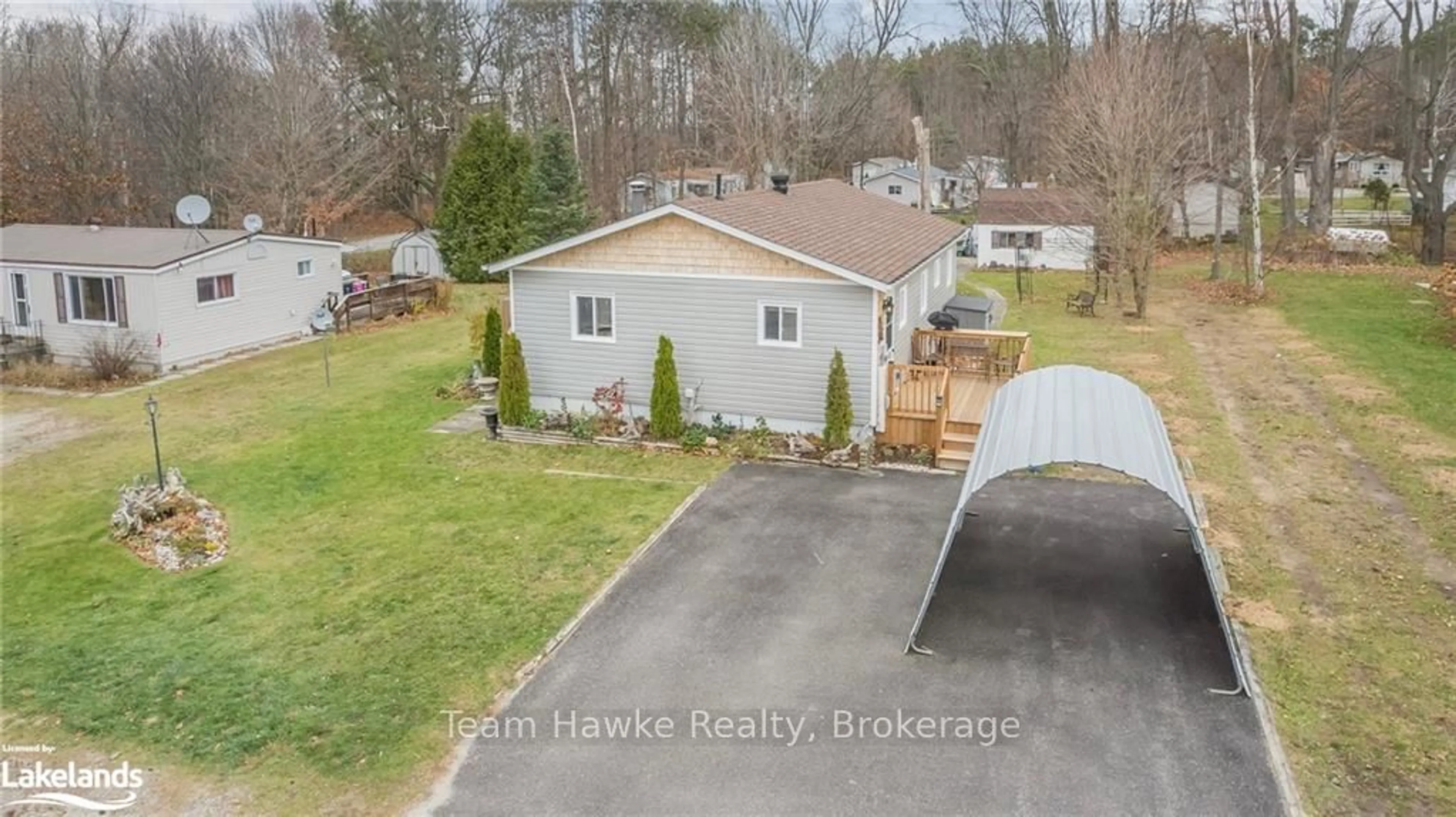 Frontside or backside of a home, the fenced backyard for 5263 ELLIOTT Sdrd #14, Tay Ontario L0K 1R0