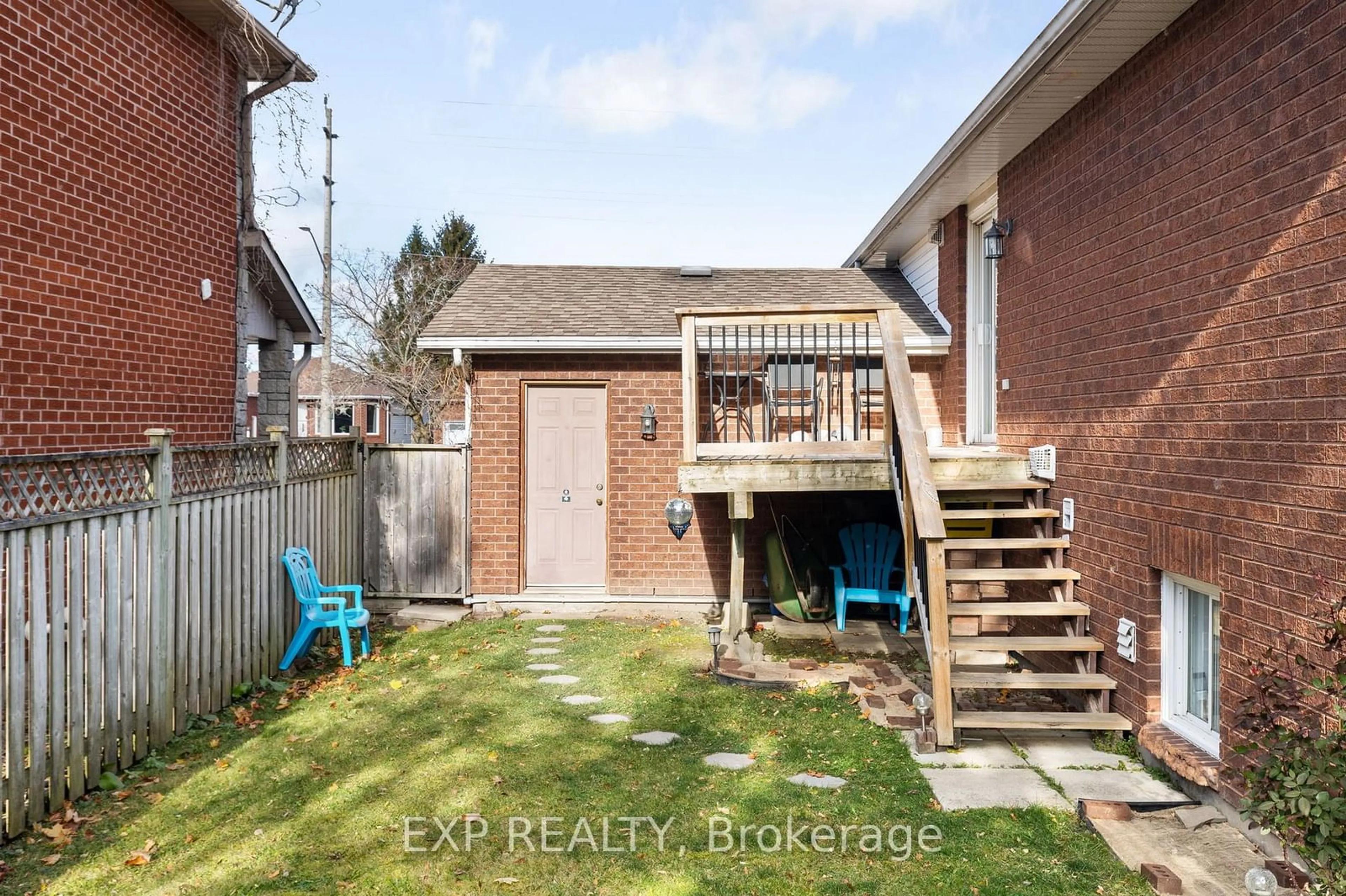 Frontside or backside of a home, the fenced backyard for 101 Livingstone St, Barrie Ontario L4N 7J4