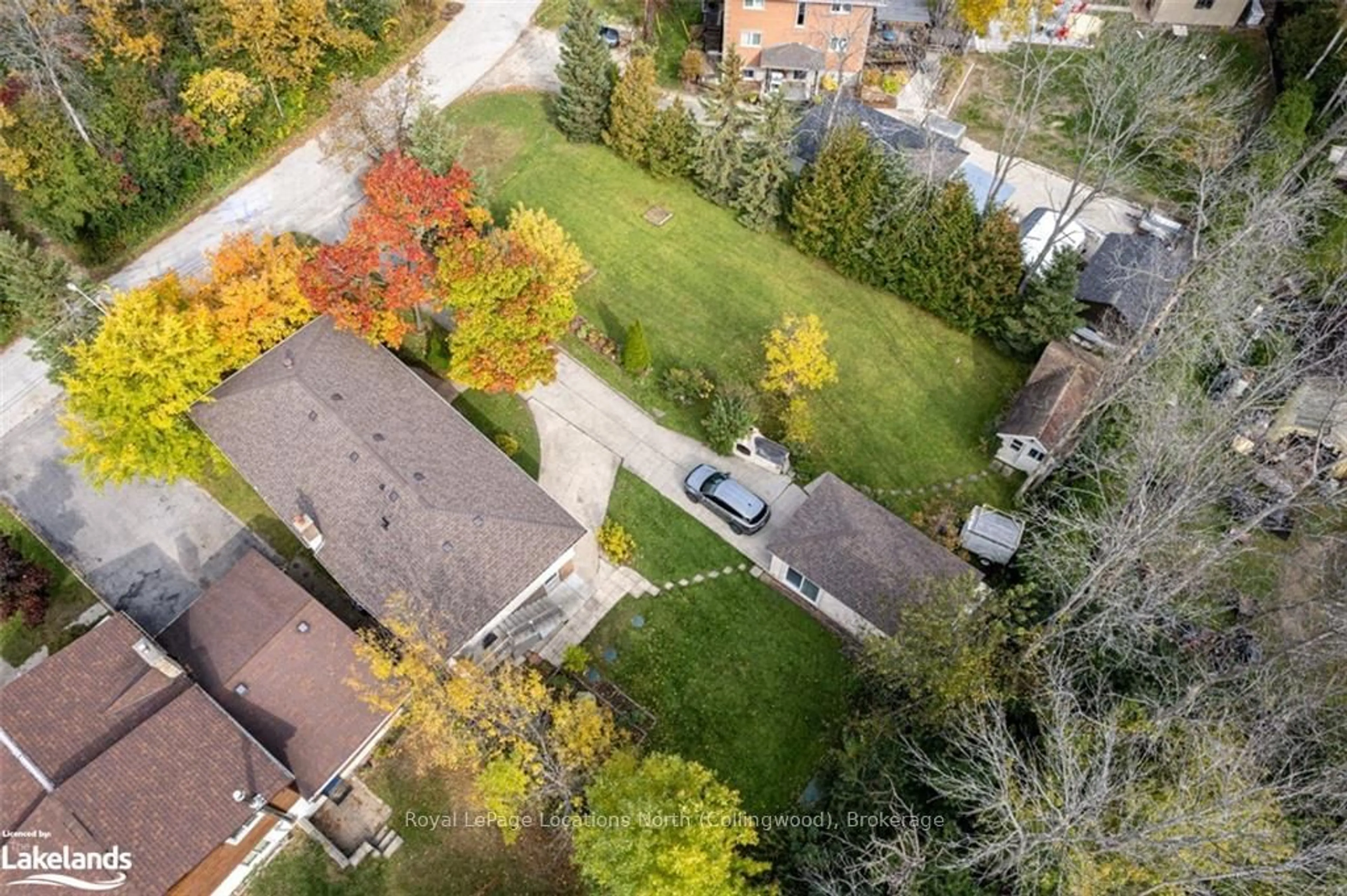 Frontside or backside of a home, the fenced backyard for 30 KOHL St, Collingwood Ontario L9Y 0X2