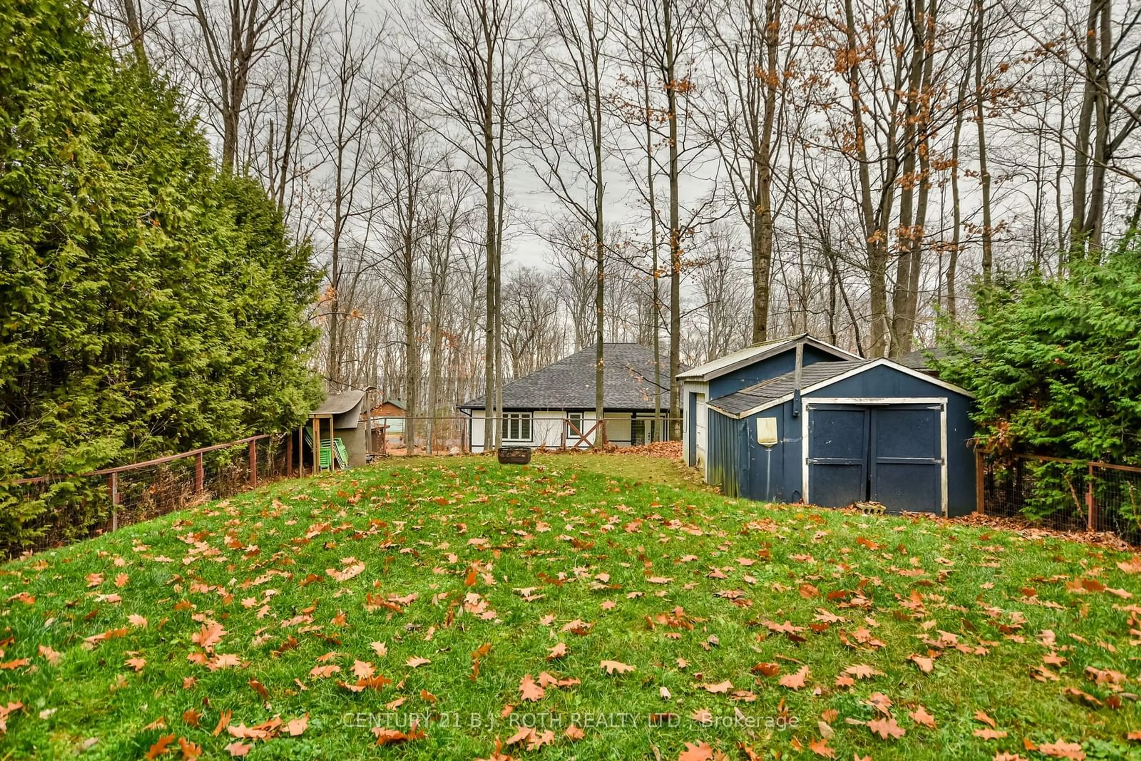 A pic from exterior of the house or condo, the fenced backyard for 53 Polish Ave, Penetanguishene Ontario L9M 1W8