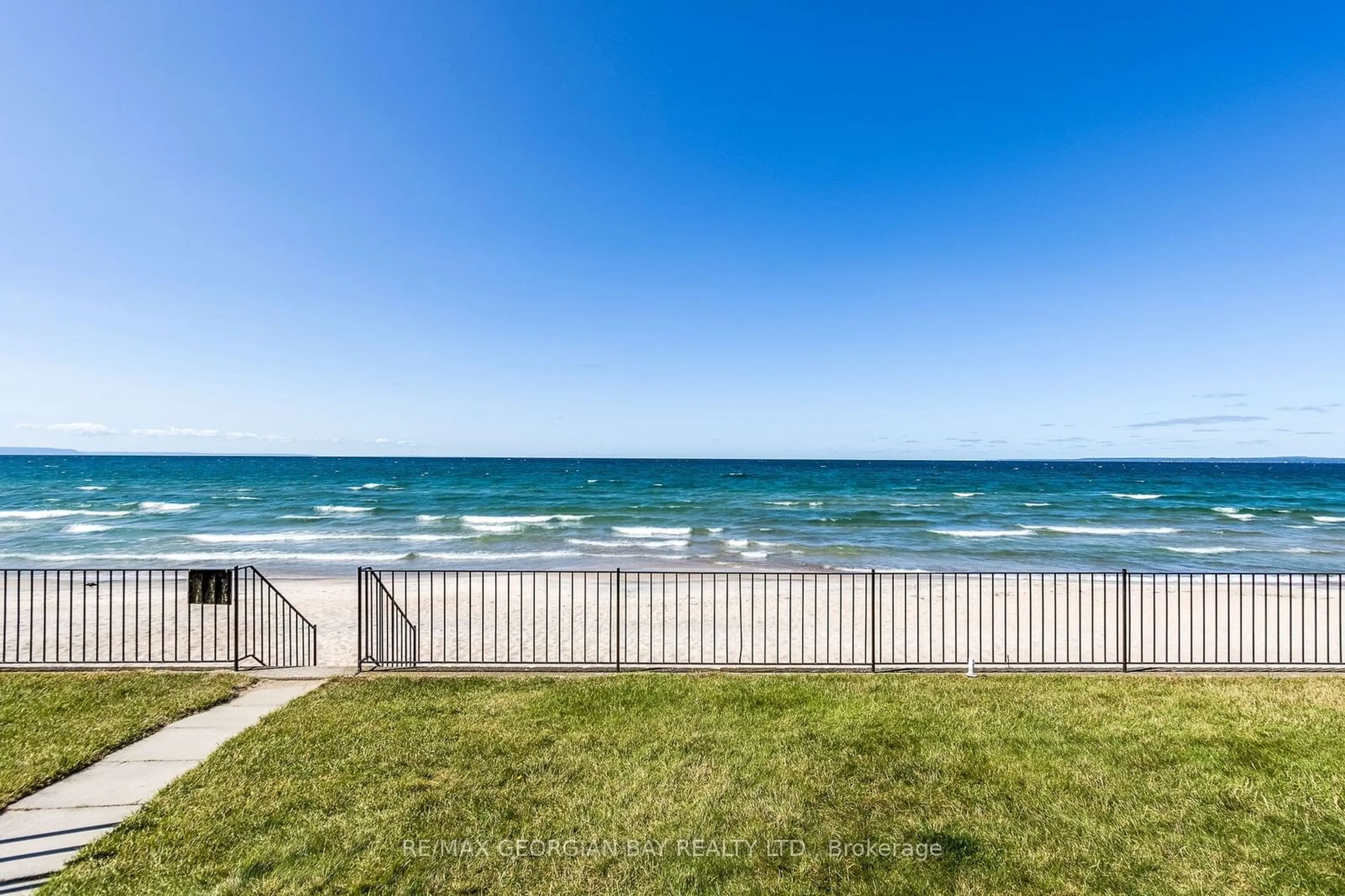 A pic from exterior of the house or condo, the fenced backyard for 1064 Tiny Beaches Rd #8, Tiny Ontario L0L 2T0