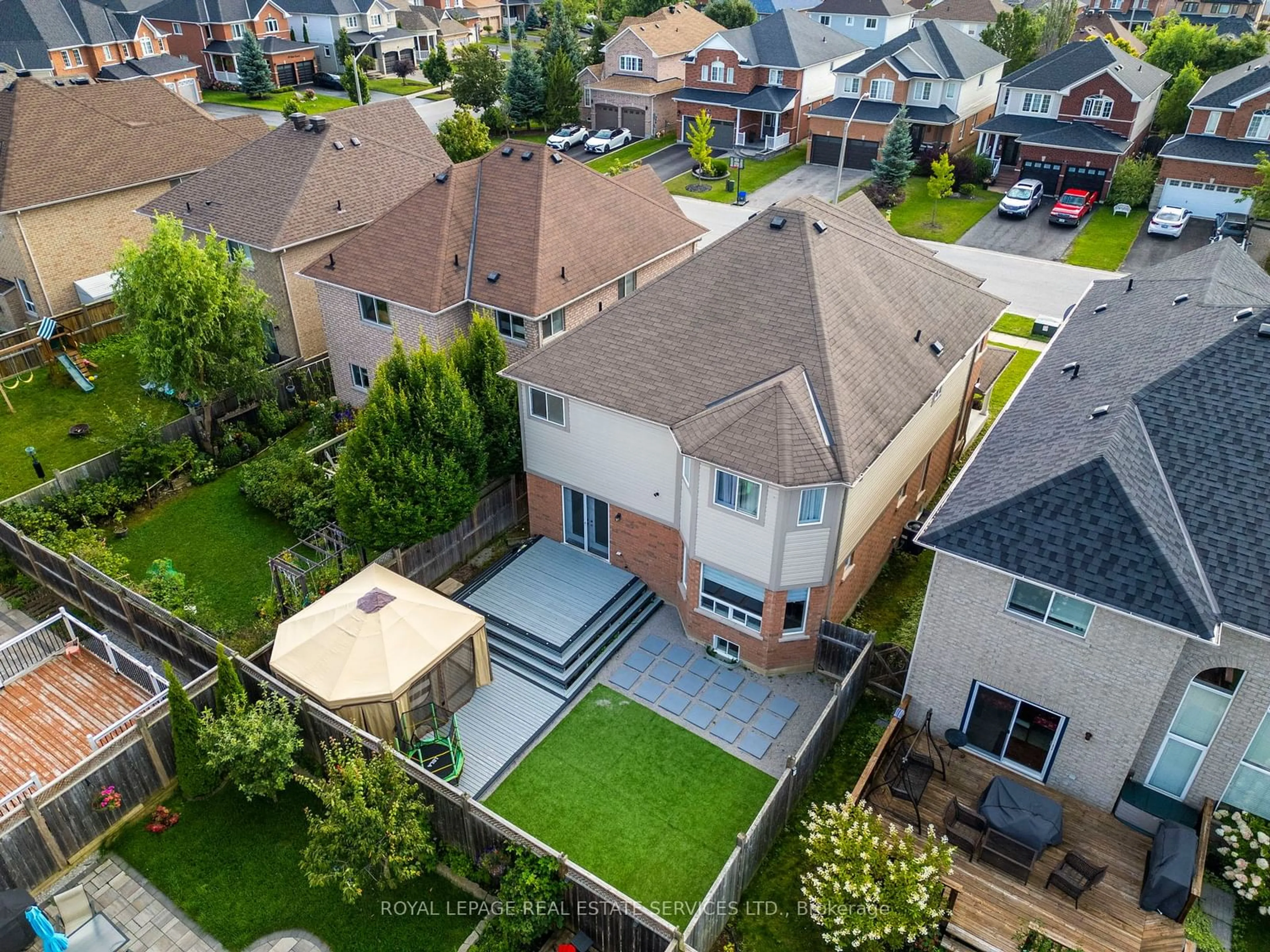 Frontside or backside of a home, the fenced backyard for 50 Tudor Cres, Barrie Ontario L4M 0A8