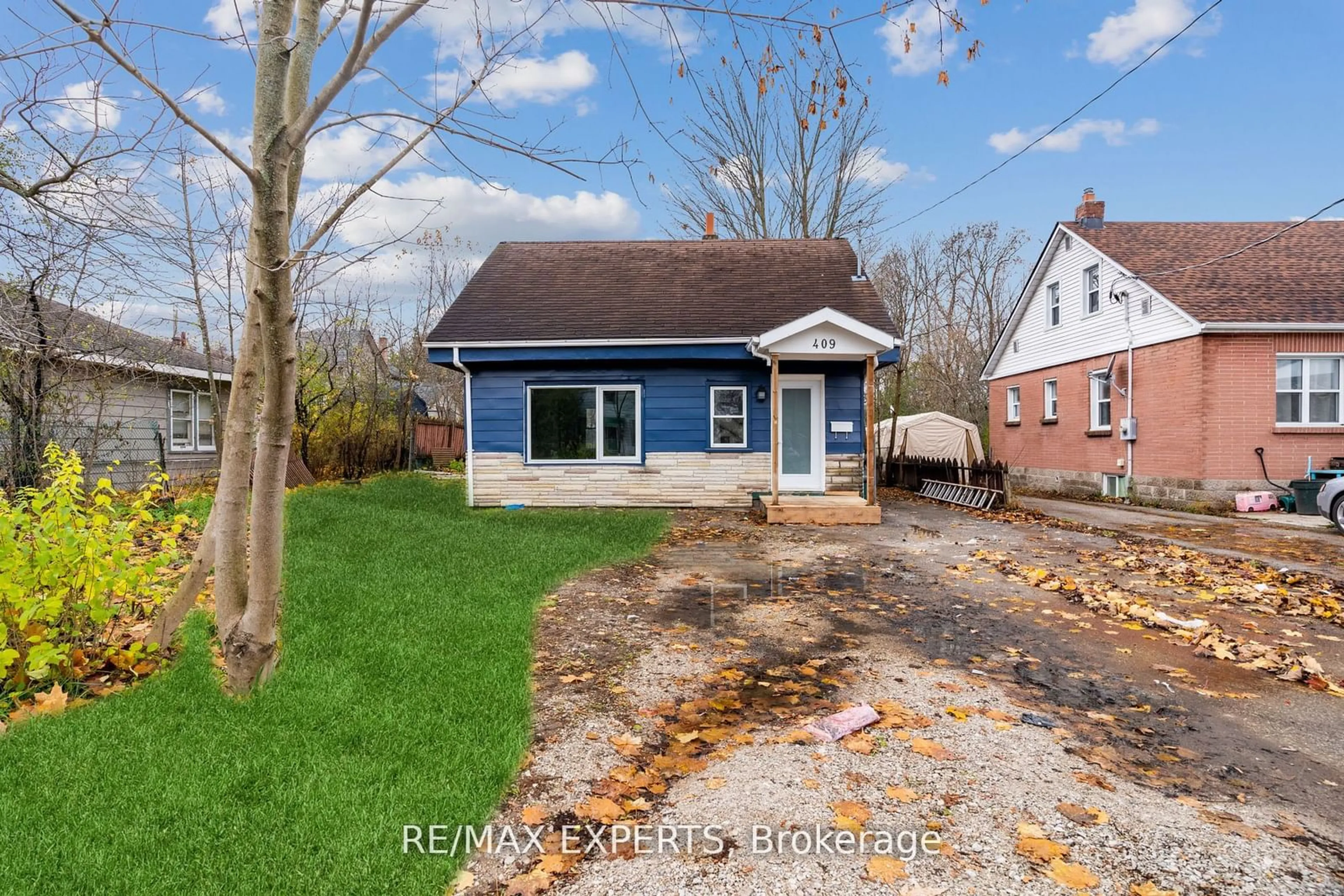 Frontside or backside of a home, the fenced backyard for 409 Gill St, Orillia Ontario L3V 4K5