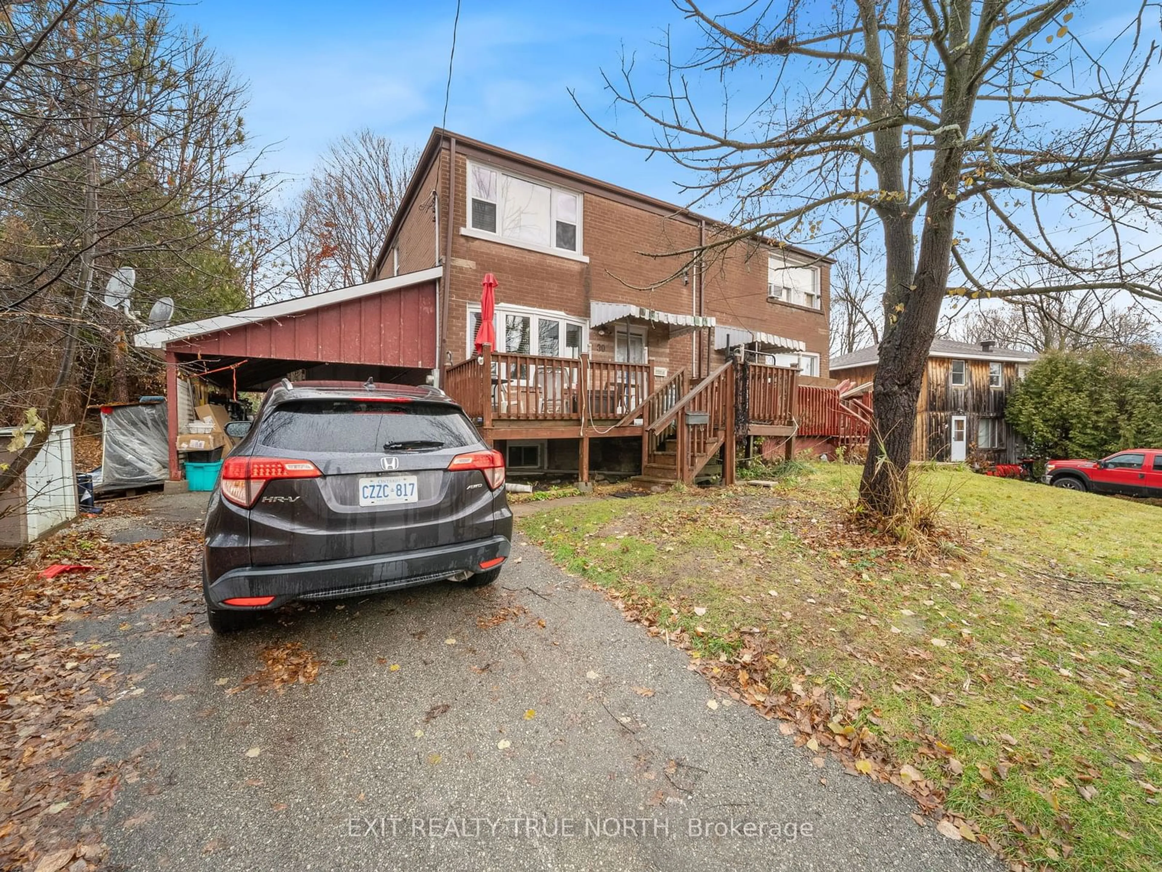 Frontside or backside of a home, the fenced backyard for 30 Sandra Dr, Orillia Ontario L3V 3G7