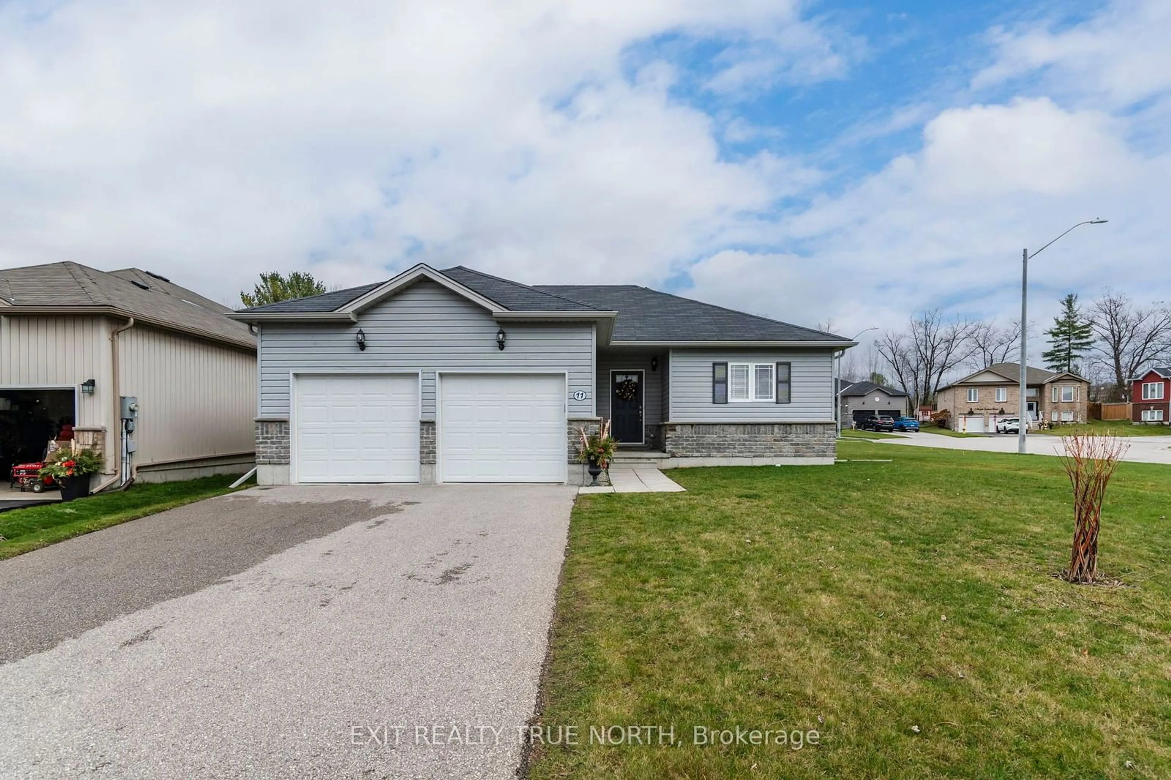 Frontside or backside of a home, the street view for 11 Charlie Rawson Blvd, Tay Ontario L0K 2A0