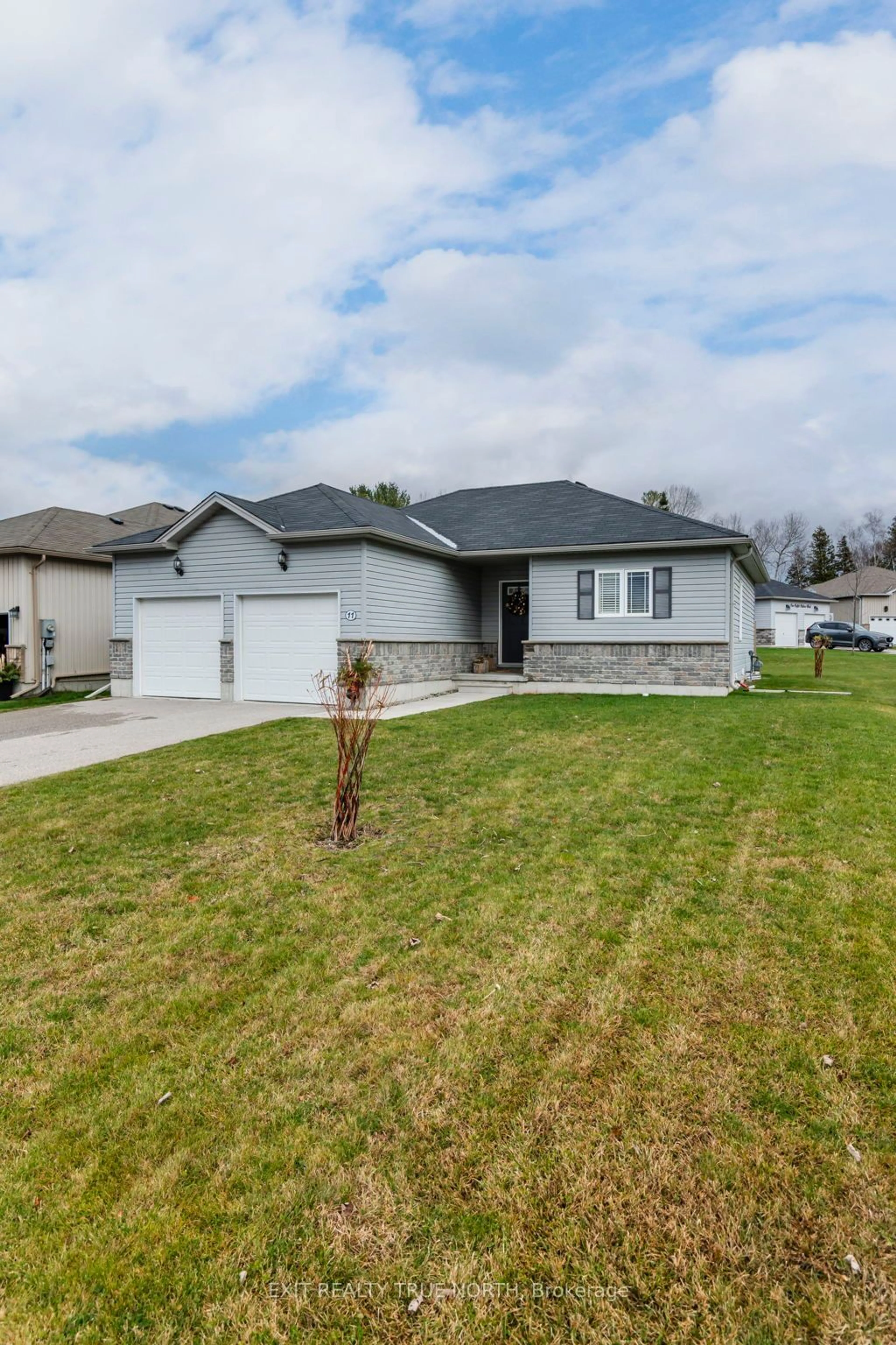 Frontside or backside of a home, the street view for 11 Charlie Rawson Blvd, Tay Ontario L0K 2A0