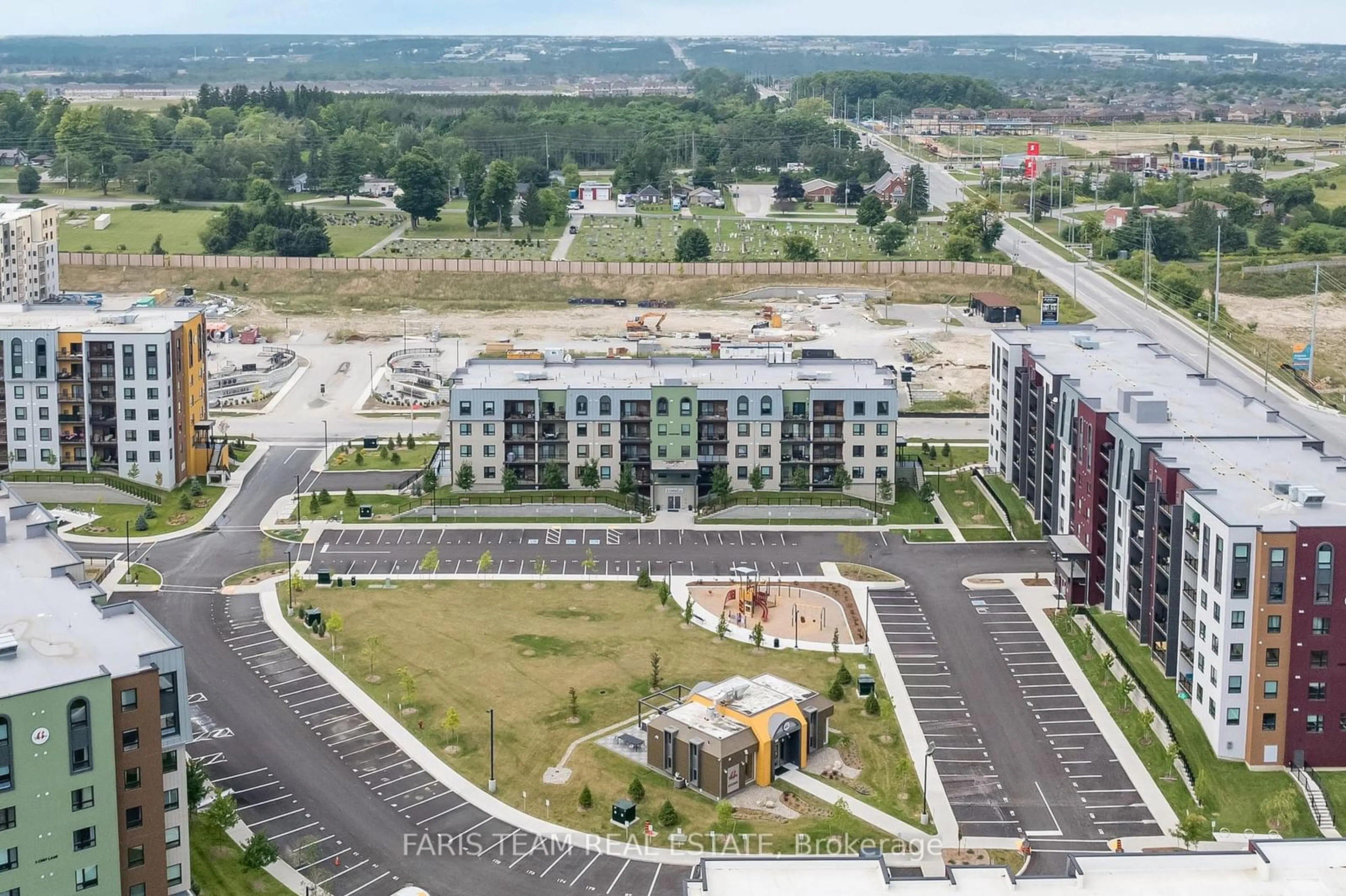 A pic from exterior of the house or condo, the view of city buildings for 6 Spice Way #302, Barrie Ontario L9J 0J9