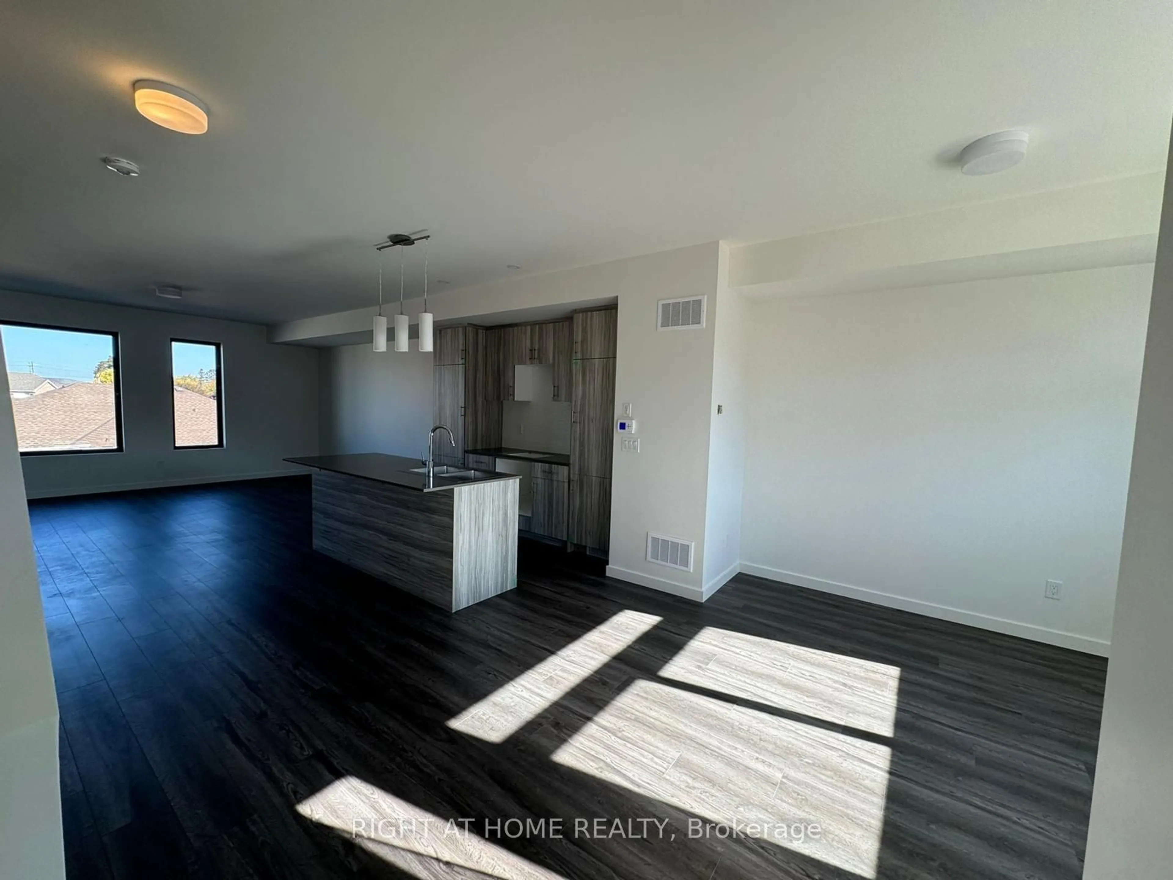 A pic of a room, wood floors for 4 Rainwater Lane, Barrie Ontario L4N 9J6