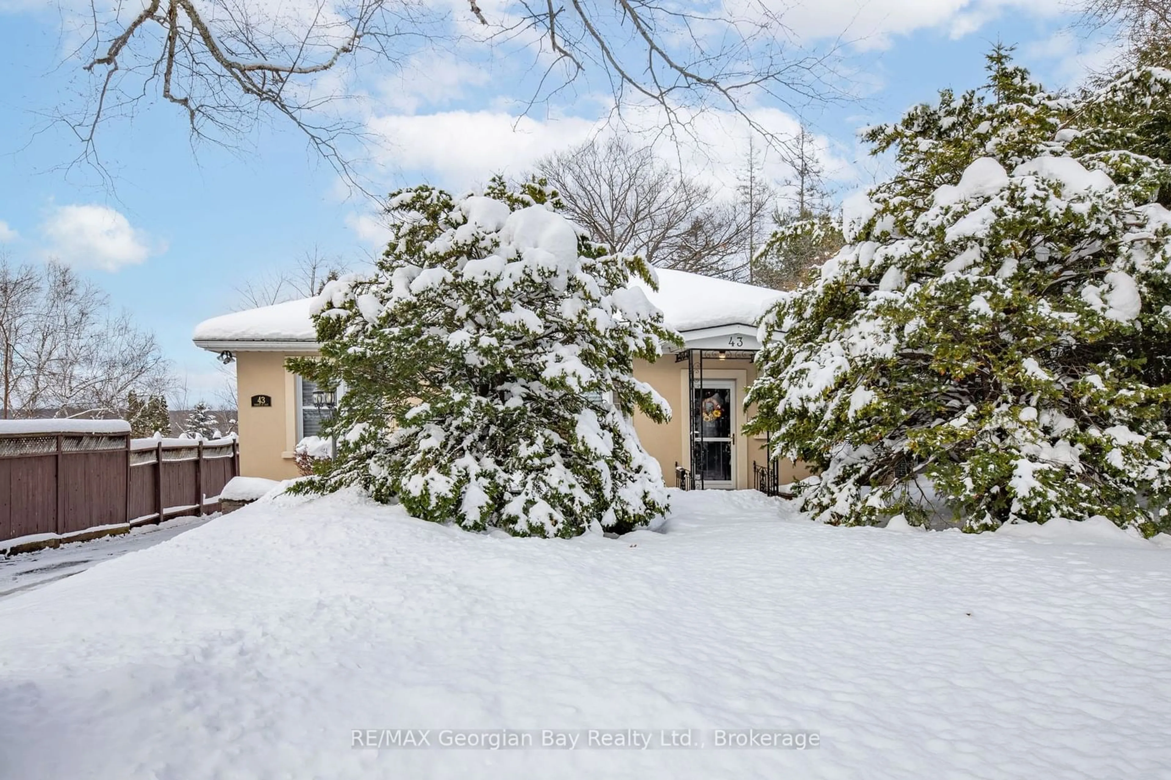 A pic from exterior of the house or condo, the fenced backyard for 43 Robert St, Penetanguishene Ontario L9M 1B1