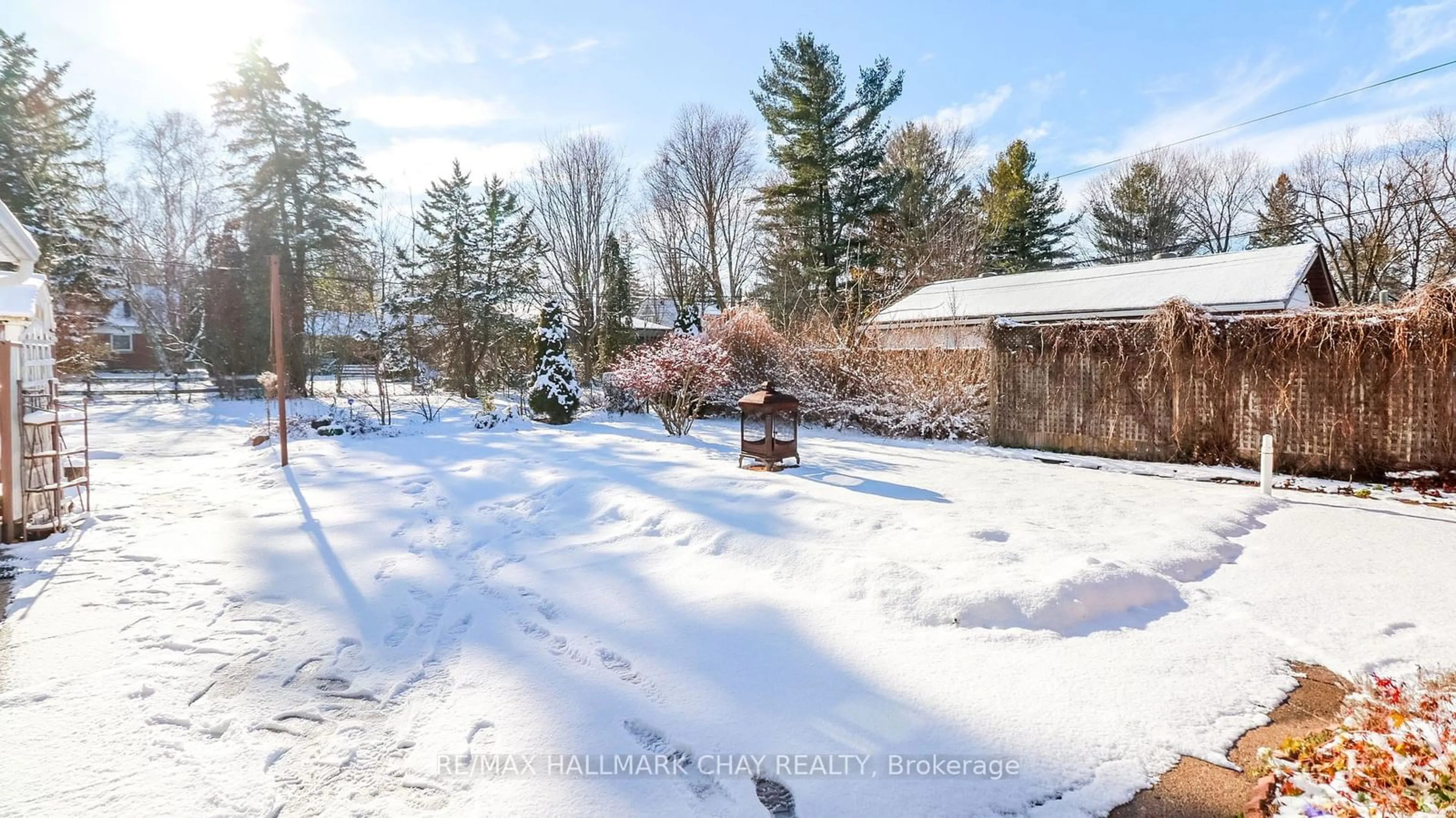 A pic from exterior of the house or condo, the fenced backyard for 65 Strabane Ave, Barrie Ontario L4M 2A1