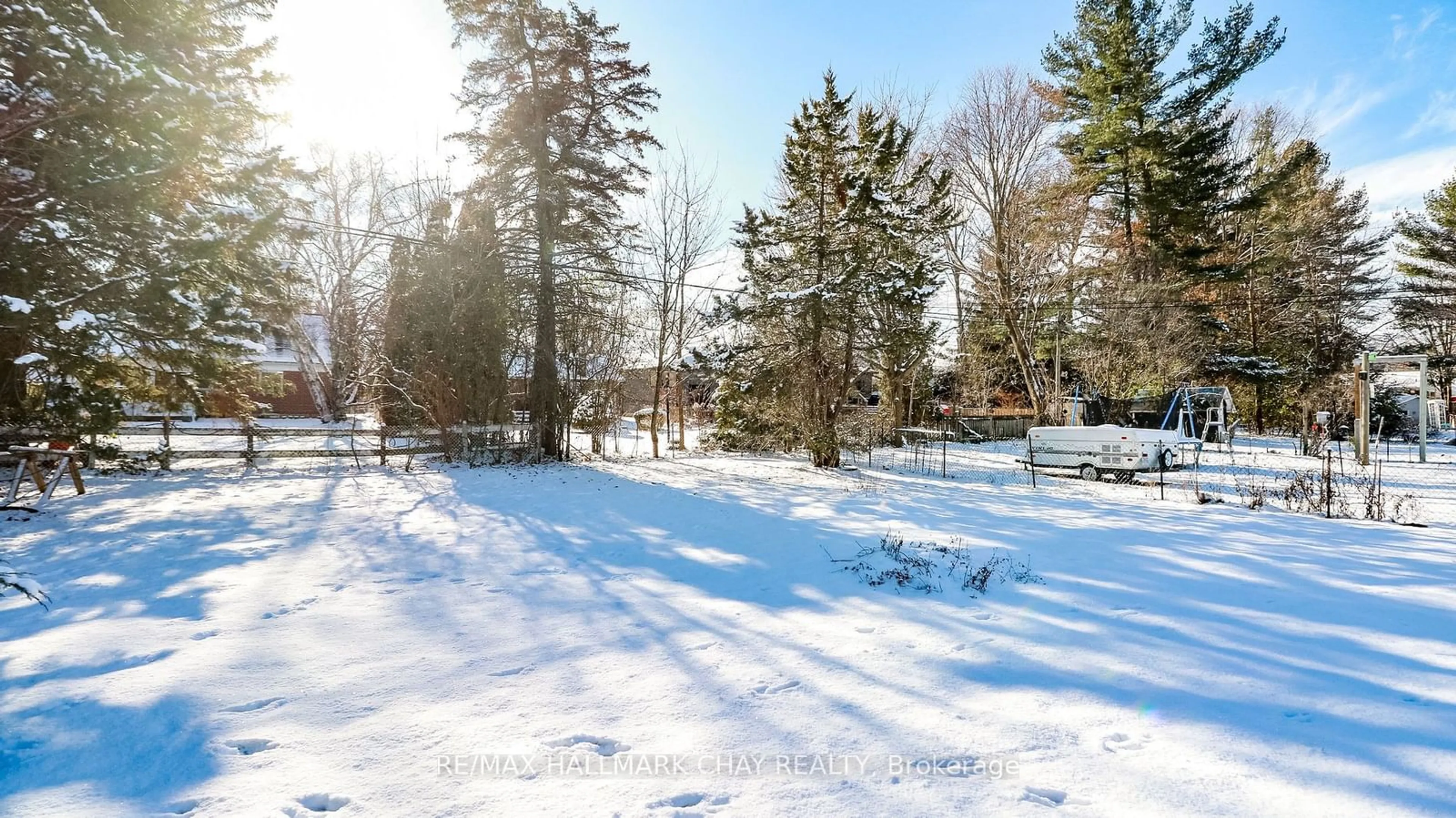 A pic from exterior of the house or condo, the fenced backyard for 65 Strabane Ave, Barrie Ontario L4M 2A1