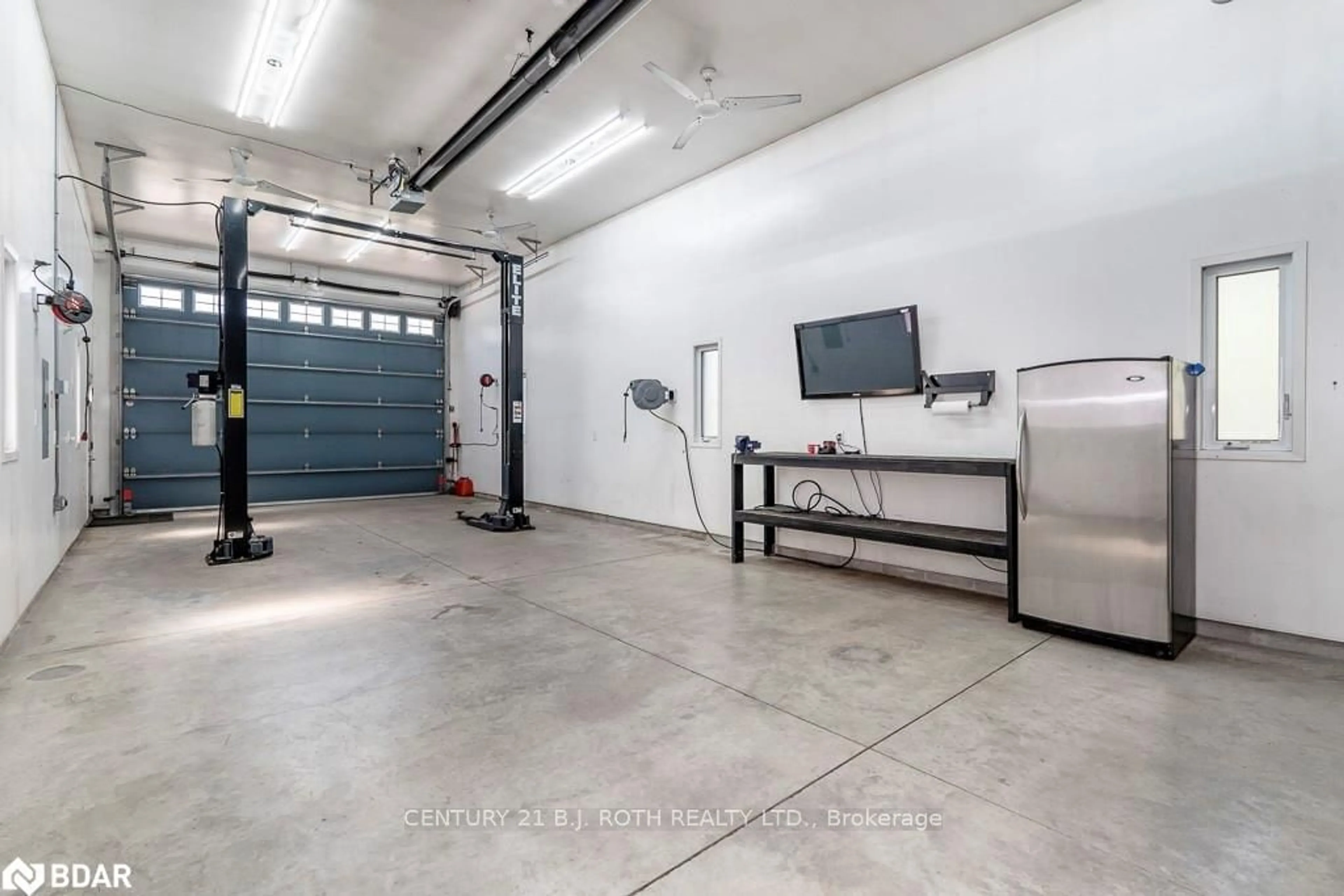 Indoor garage, cement floor for 2403 Sunnidale Rd, Springwater Ontario L0M 1T2