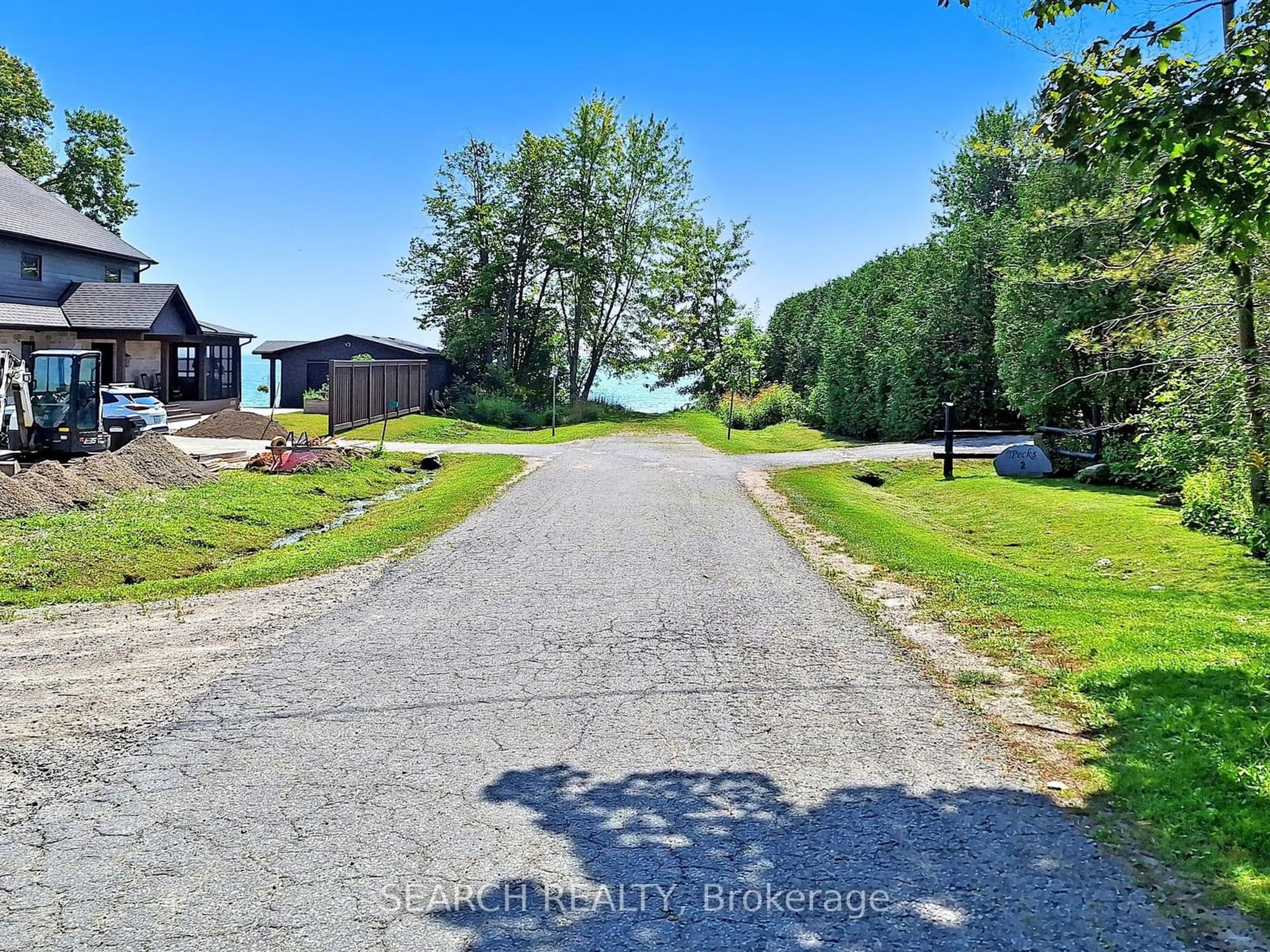 A pic from outside/outdoor area/front of a property/back of a property/a pic from drone, water/lake/river/ocean view for 71 Lakeshore Rd, Oro-Medonte Ontario L0L 2E0