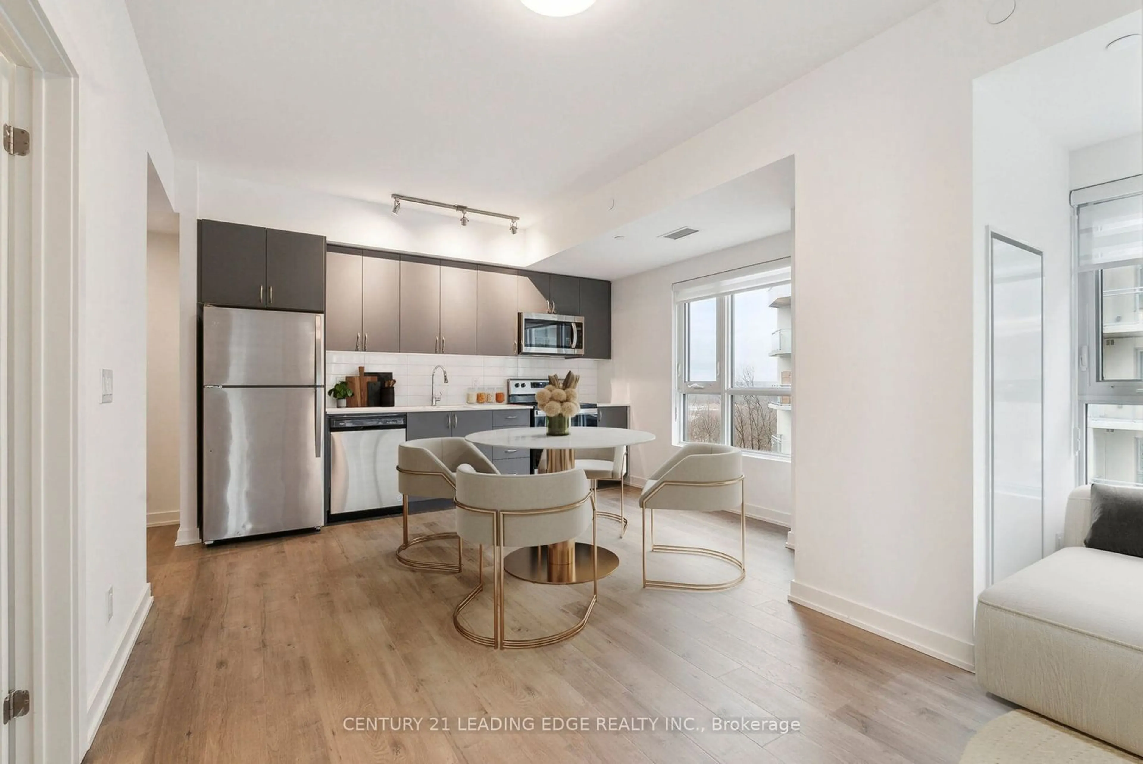 Open concept kitchen, wood/laminate floor for 56 Lakeside Terr #710, Barrie Ontario L4M 0L4