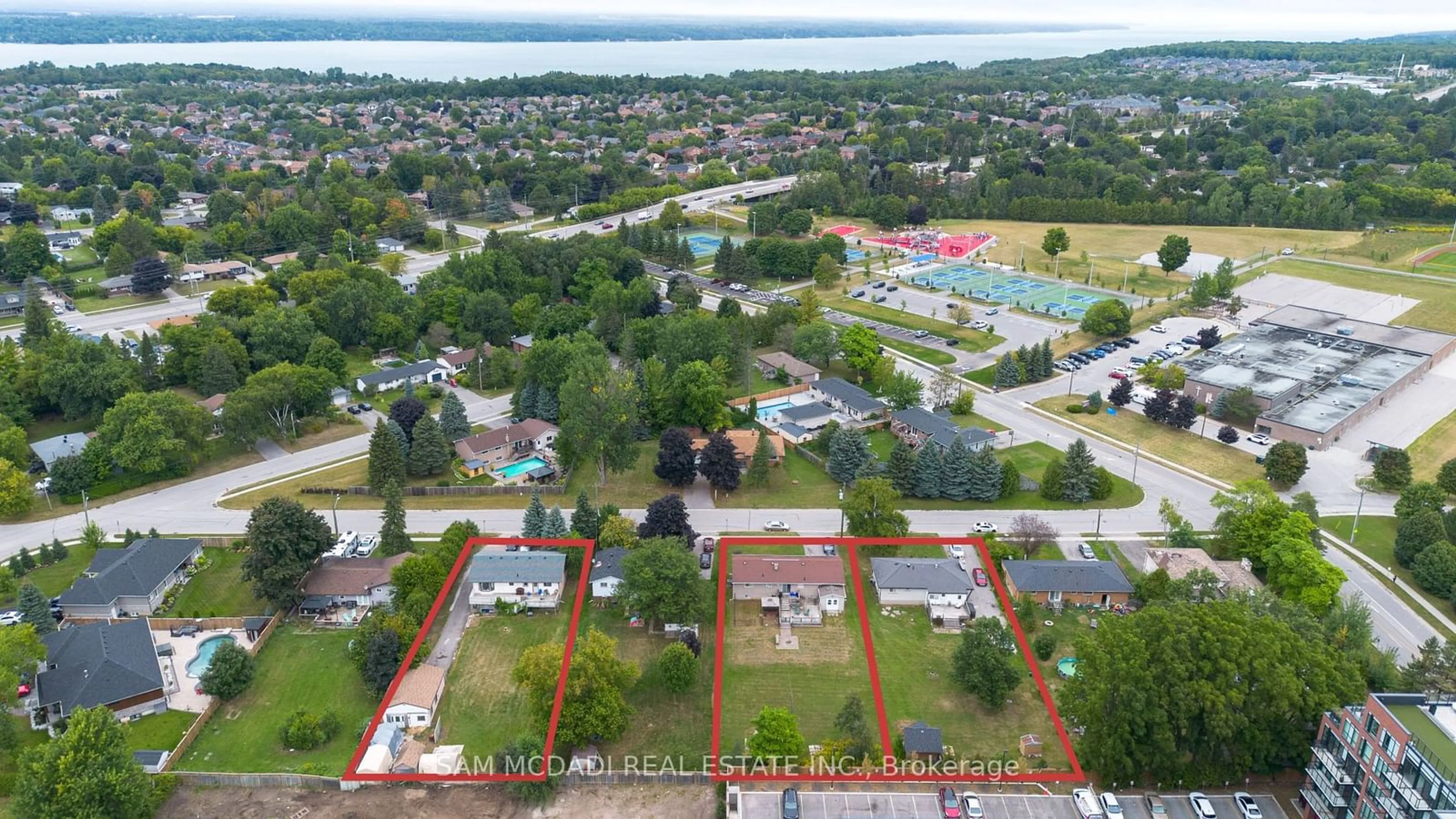 A pic from outside/outdoor area/front of a property/back of a property/a pic from drone, water/lake/river/ocean view for 213 Kenneth Ave, Barrie Ontario L4N 4H2