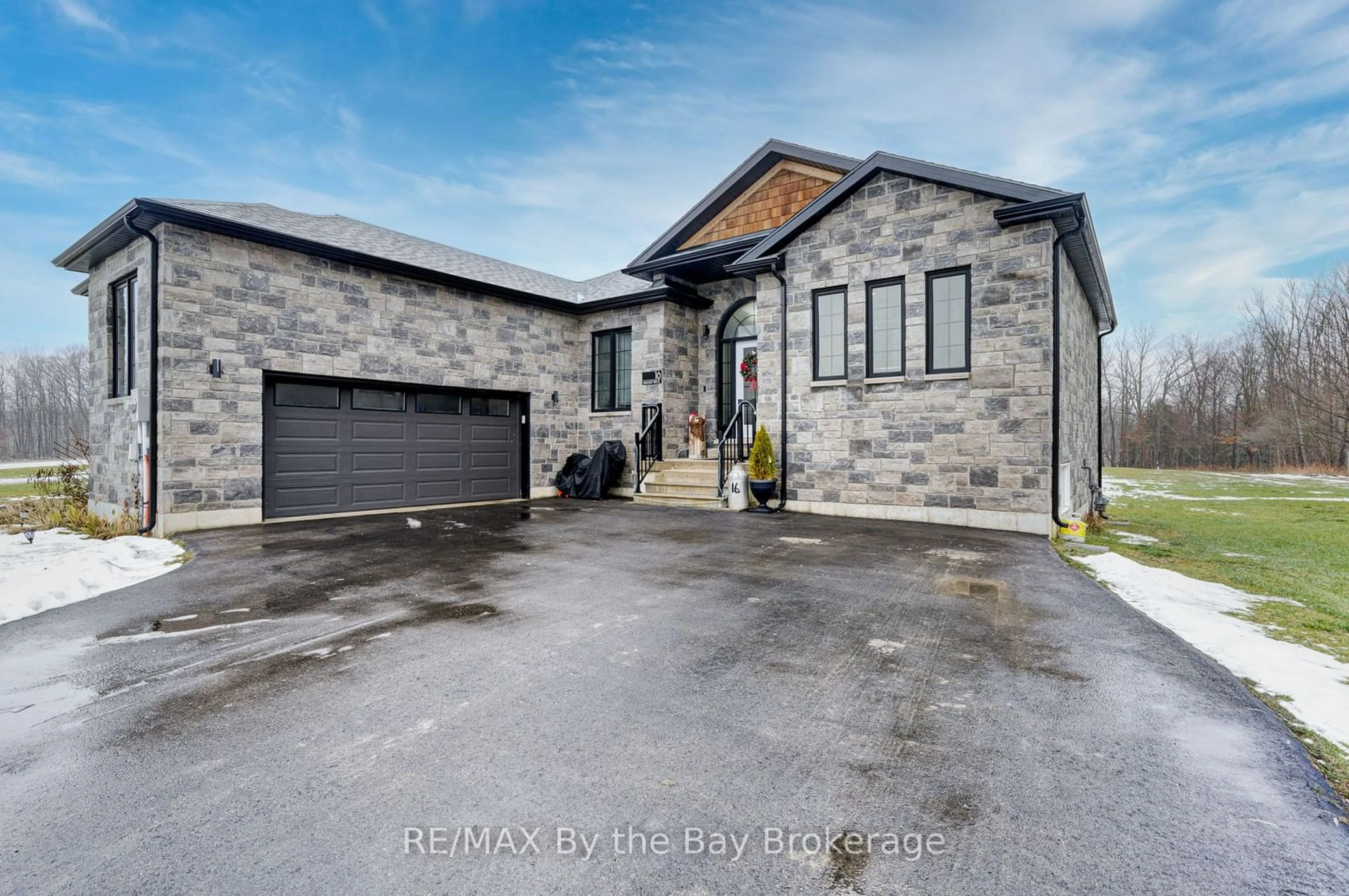 Home with brick exterior material, street for 16 Walnut Dr, Wasaga Beach Ontario L9Z 0A9