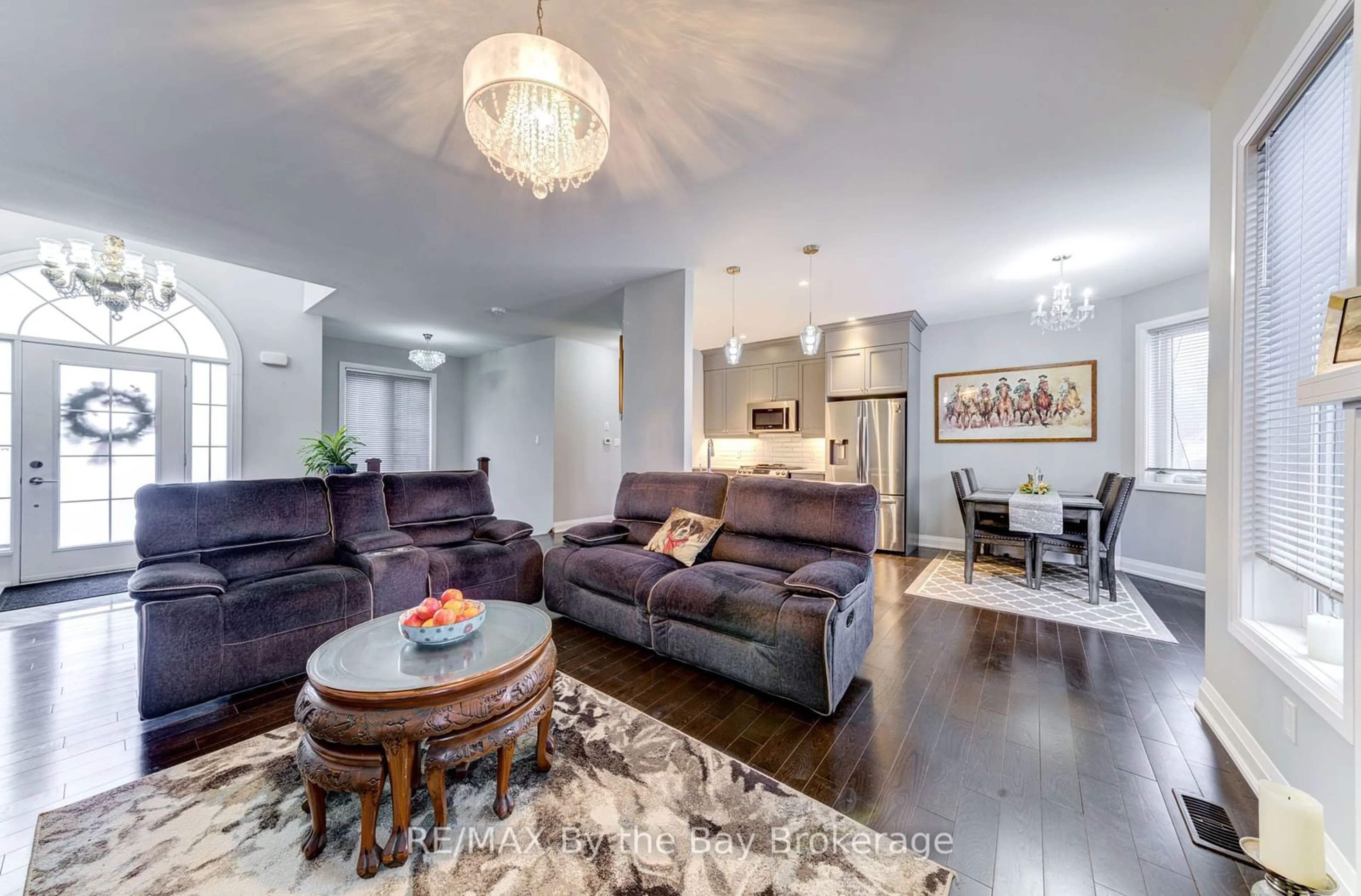 Living room with furniture, wood/laminate floor for 16 Walnut Dr, Wasaga Beach Ontario L9Z 0A9