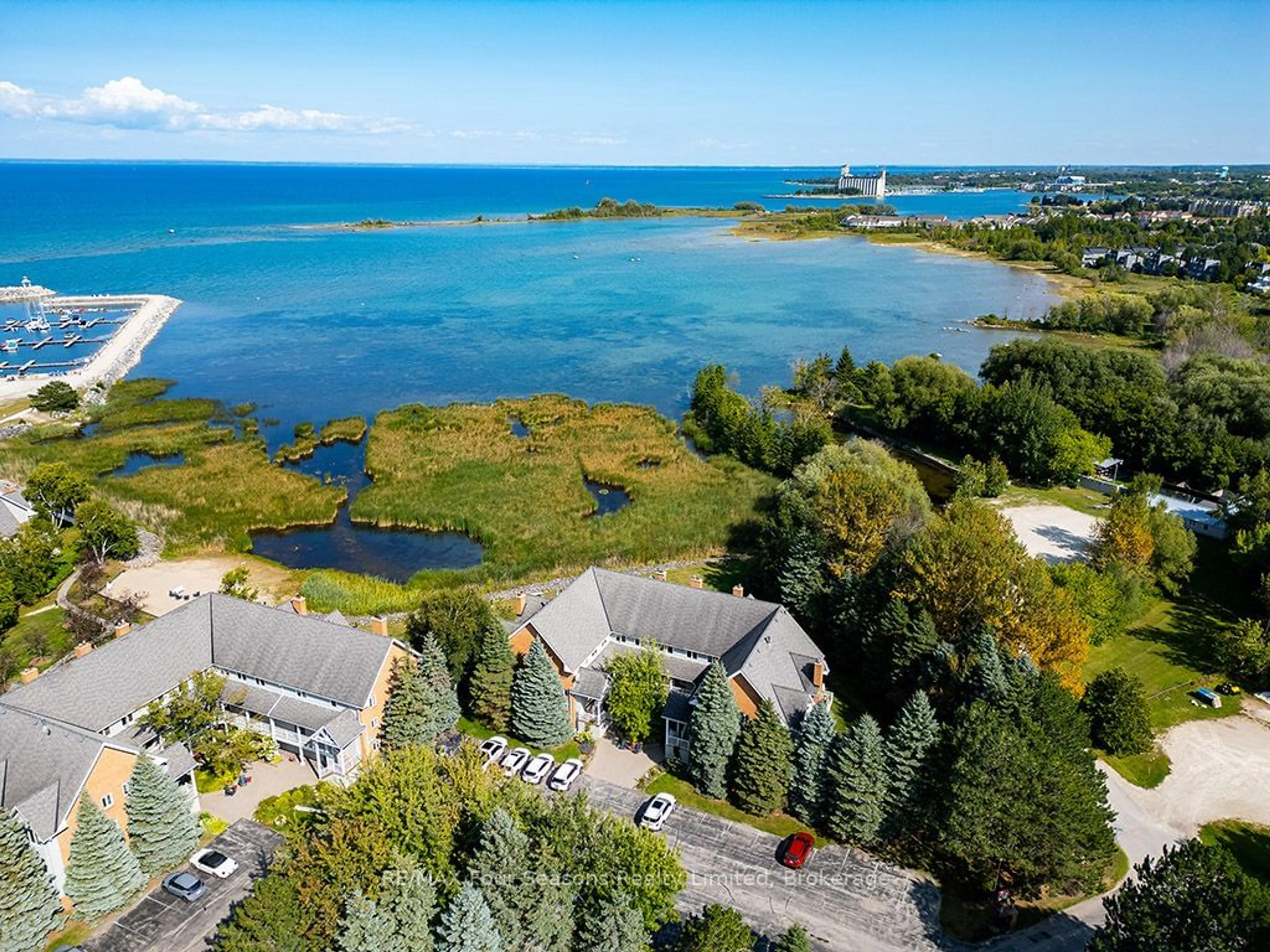 A pic from outside/outdoor area/front of a property/back of a property/a pic from drone, water/lake/river/ocean view for 2 RAMBLINGS Way #9, Collingwood Ontario L9Y 5C6