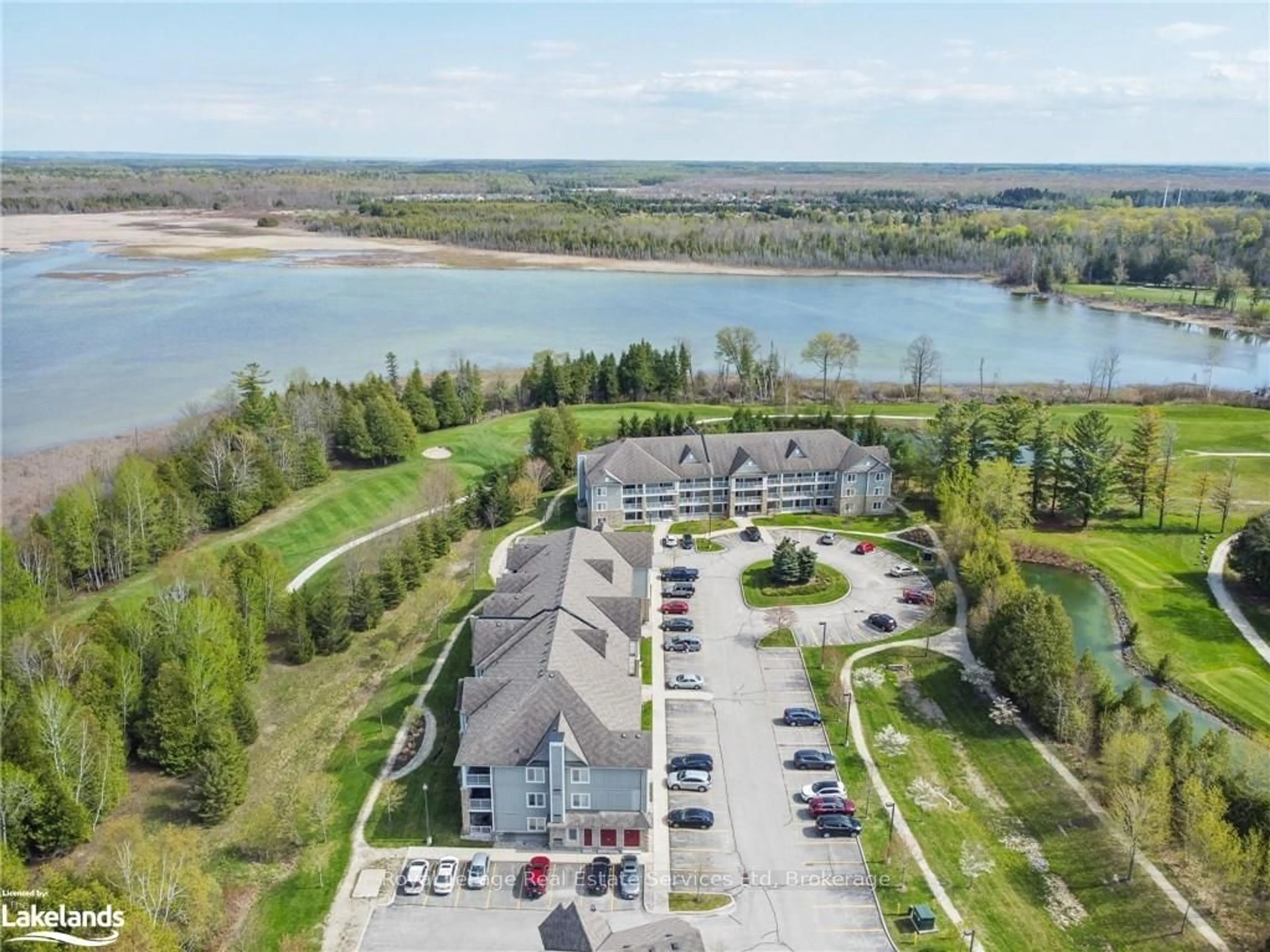 A pic from outside/outdoor area/front of a property/back of a property/a pic from drone, water/lake/river/ocean view for 50 MULLIGAN Lane #213, Wasaga Beach Ontario L9Z 0C5