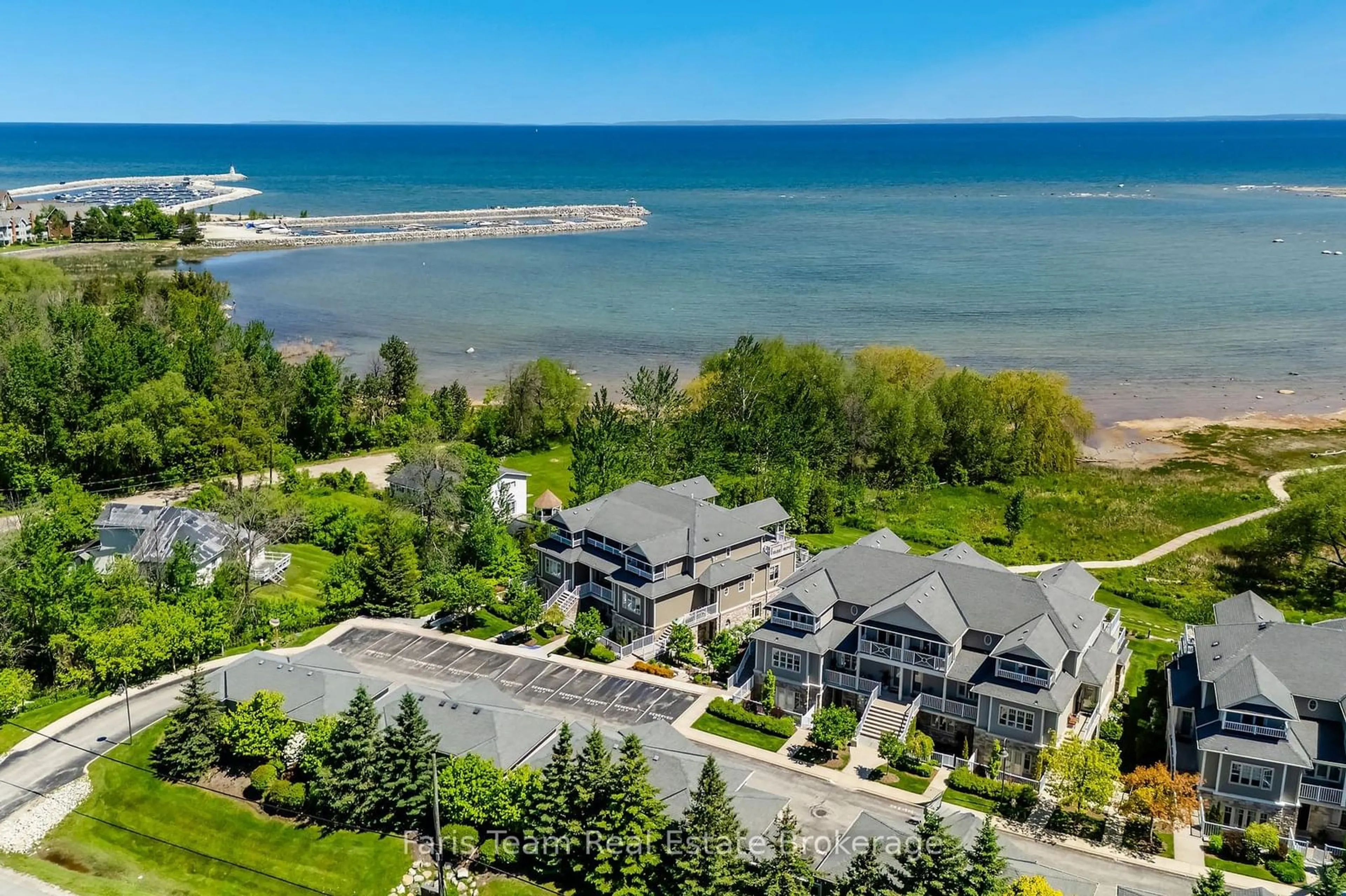 A pic from outside/outdoor area/front of a property/back of a property/a pic from drone, water/lake/river/ocean view for 40 Trott Blvd #701, Collingwood Ontario L9Y 5K5