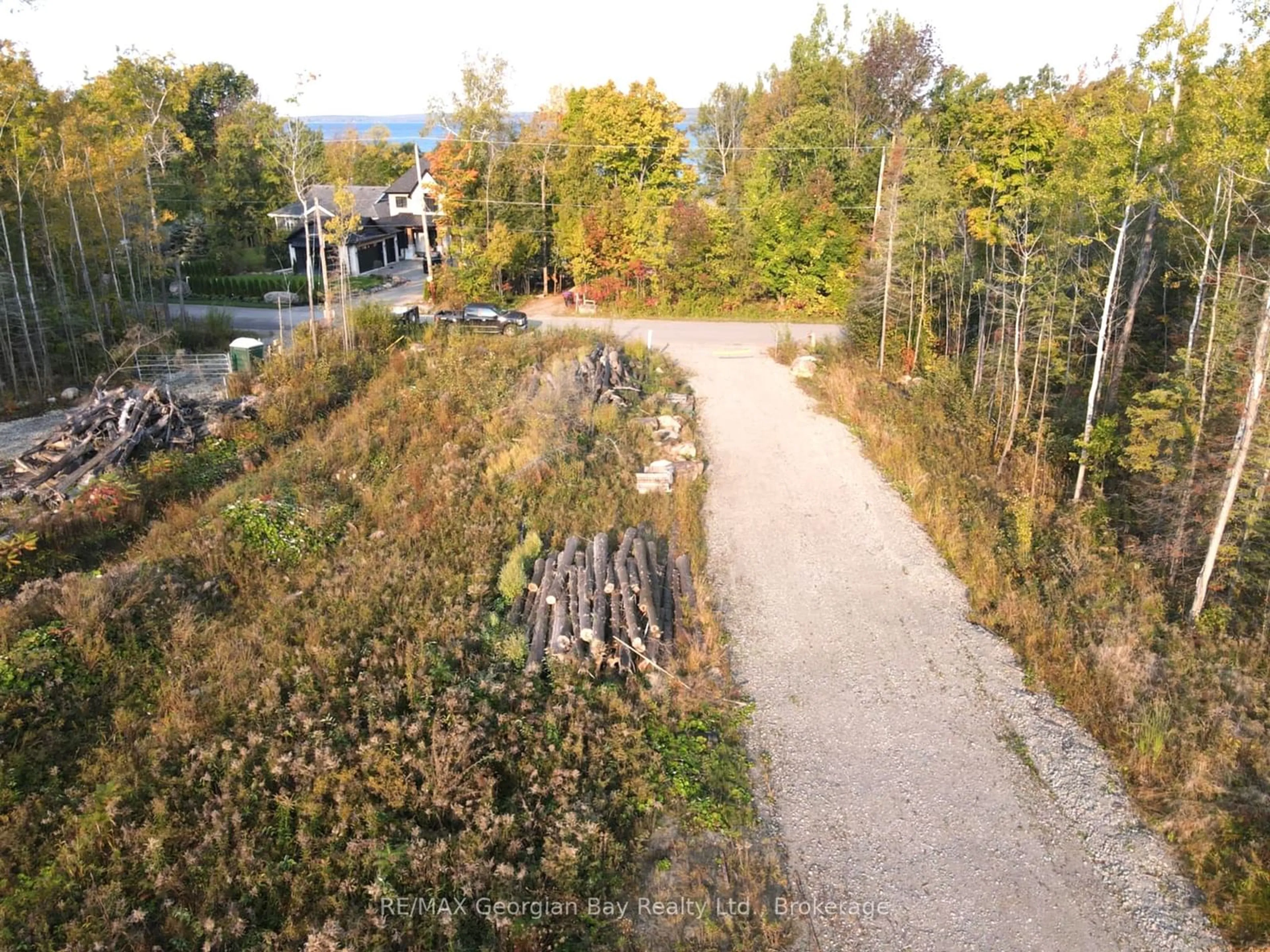 A pic from outside/outdoor area/front of a property/back of a property/a pic from drone, forest/trees view for 465 SILVER BIRCH Dr, Tiny Ontario L9M 0M5