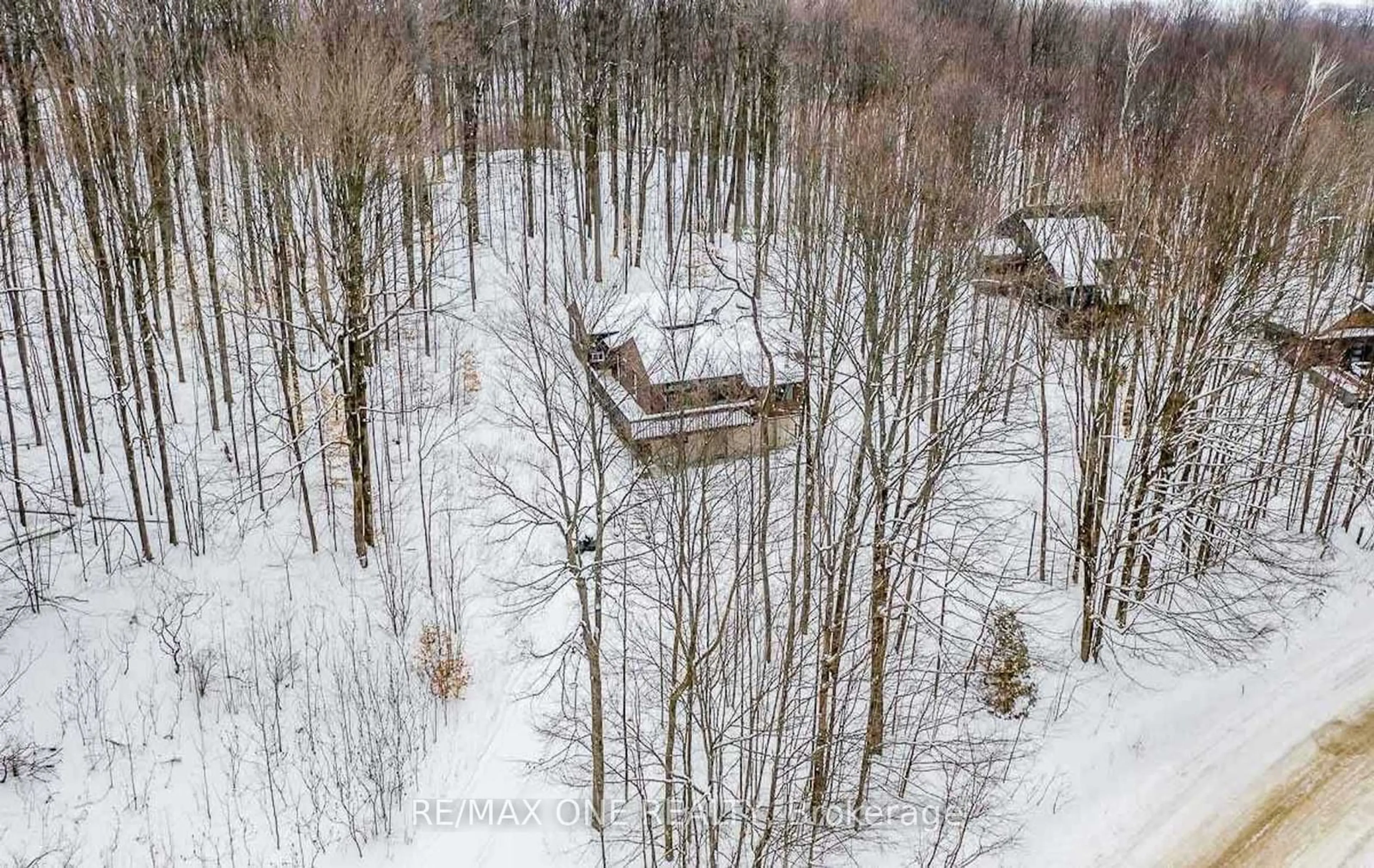 A pic from outside/outdoor area/front of a property/back of a property/a pic from drone, forest/trees view for 33 Huronwoods Dr, Oro-Medonte Ontario L0K 1E0