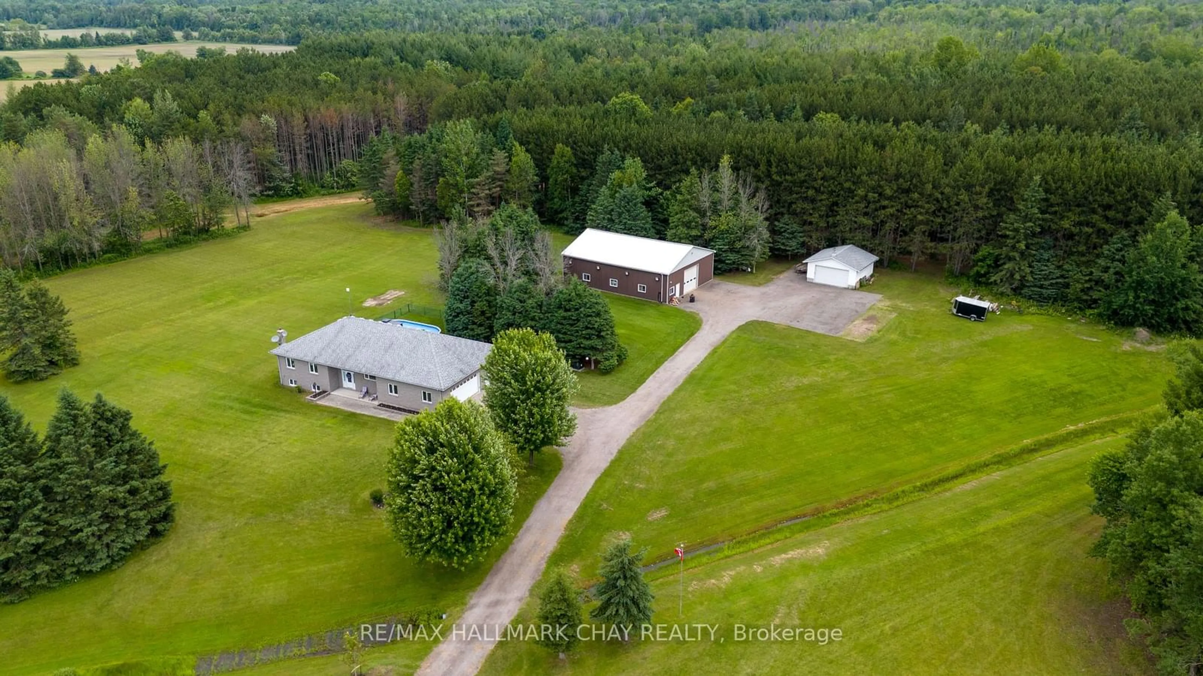 A pic from outside/outdoor area/front of a property/back of a property/a pic from drone, building for 13895 County Rd 27, Springwater Ontario L0L 2K0