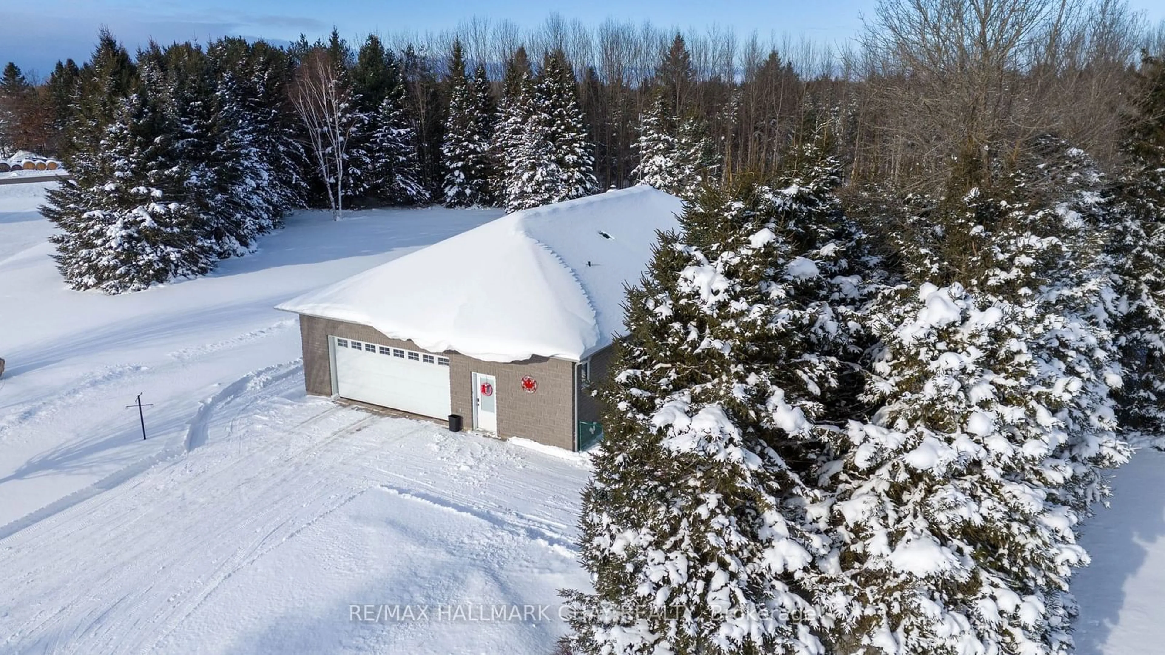 A pic from outside/outdoor area/front of a property/back of a property/a pic from drone, unknown for 13895 County Rd 27, Springwater Ontario L0L 2K0