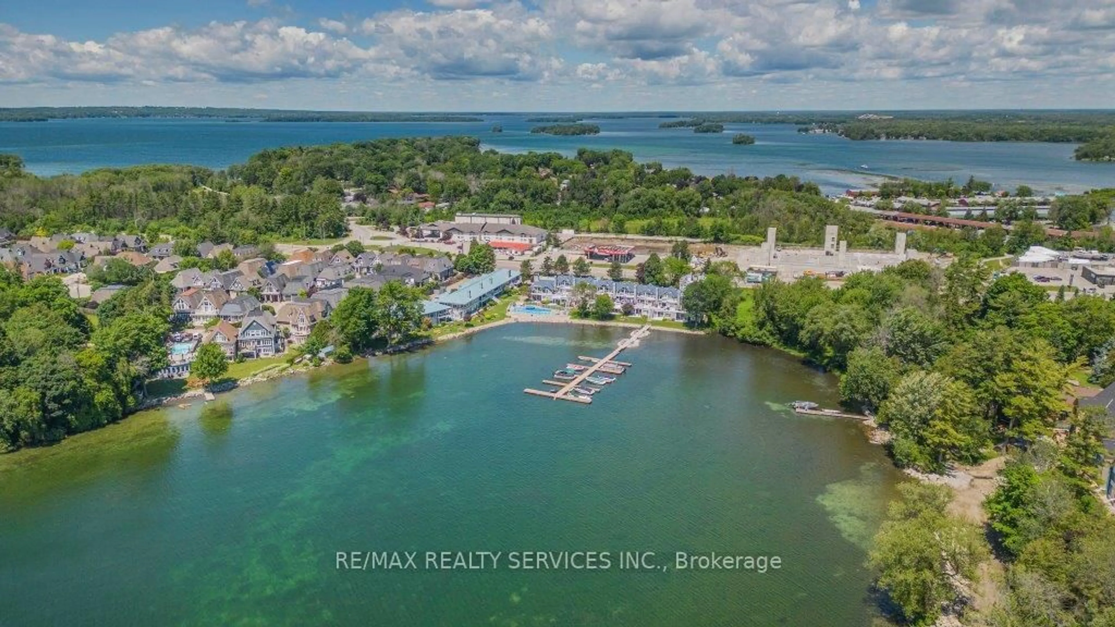 A pic from outside/outdoor area/front of a property/back of a property/a pic from drone, water/lake/river/ocean view for 585 Atherley Rd #103, Orillia Ontario L3V 7L4