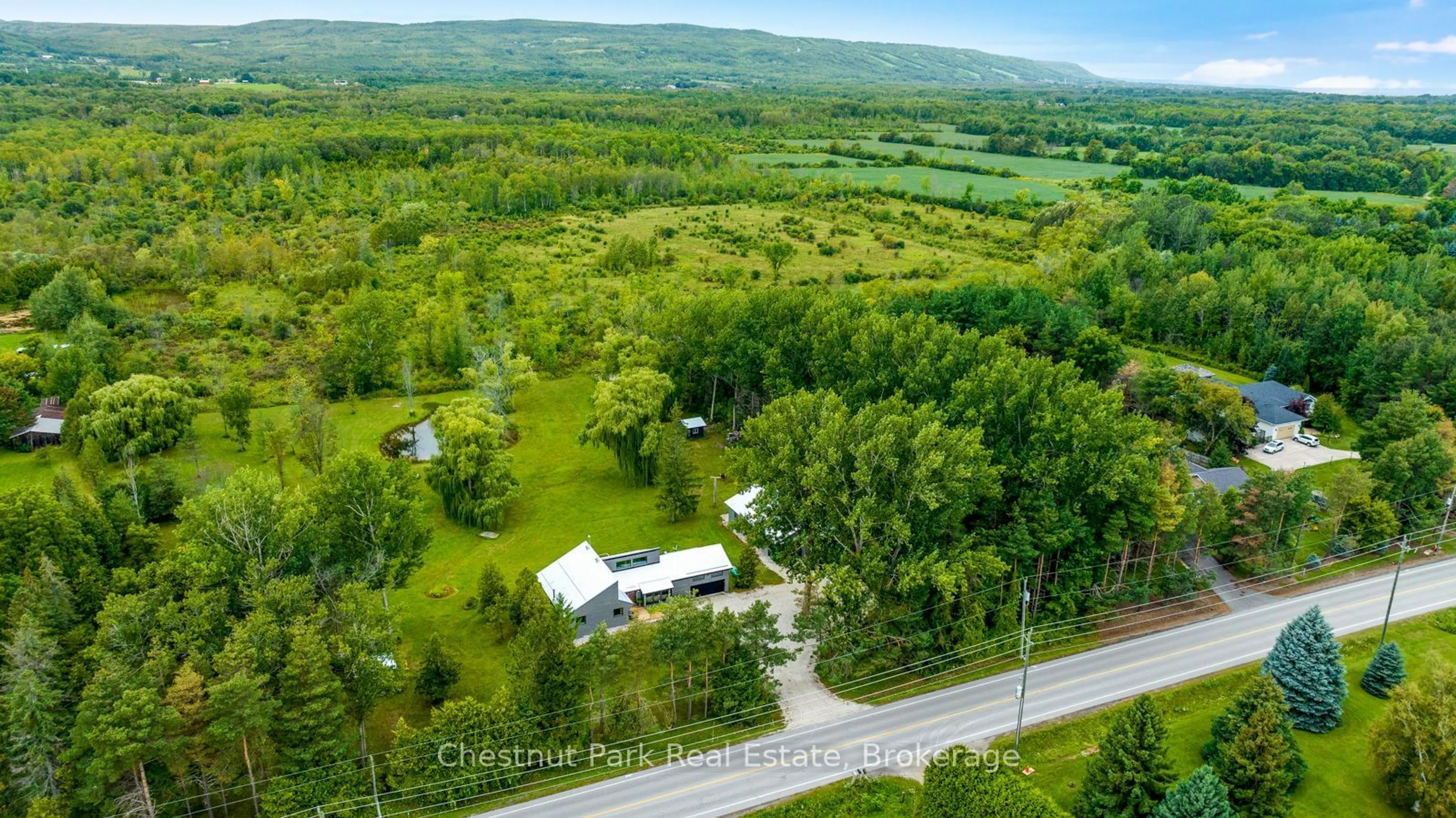 A pic from outside/outdoor area/front of a property/back of a property/a pic from drone, forest/trees view for 2890 Nottawasaga Conc 10, Clearview Ontario L9Y 3Y9