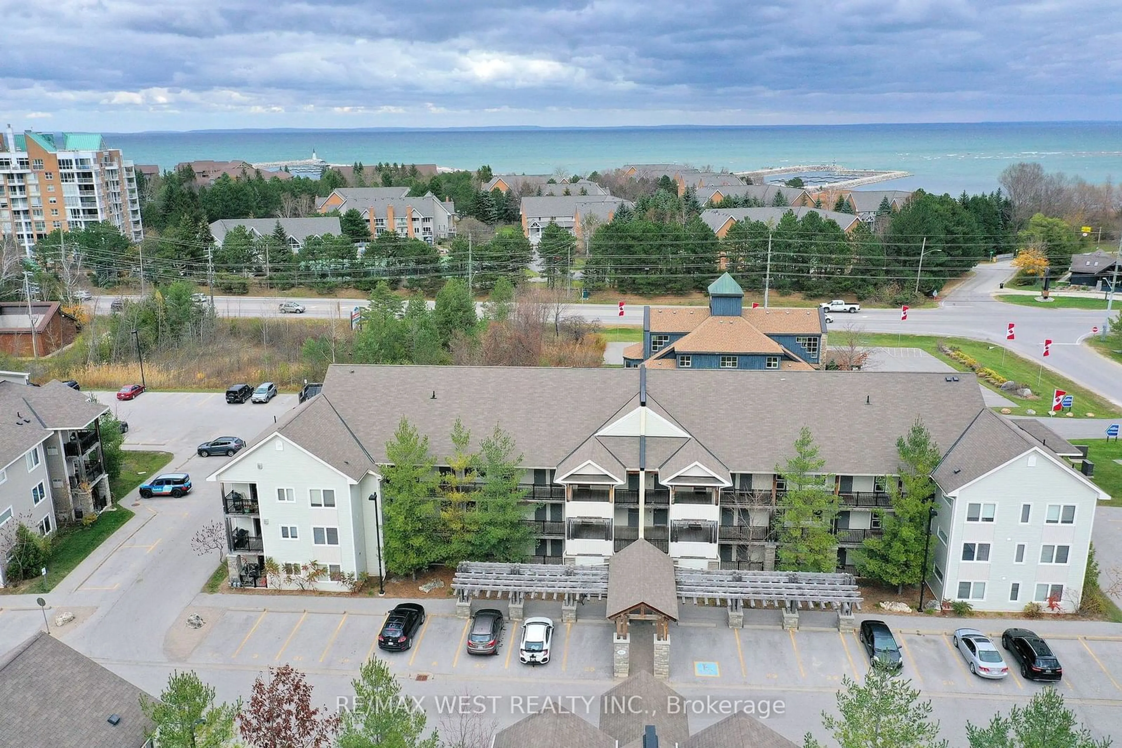 A pic from outside/outdoor area/front of a property/back of a property/a pic from drone, water/lake/river/ocean view for 1 Brandy Lane Dr #203, Collingwood Ontario L9Y 0X4