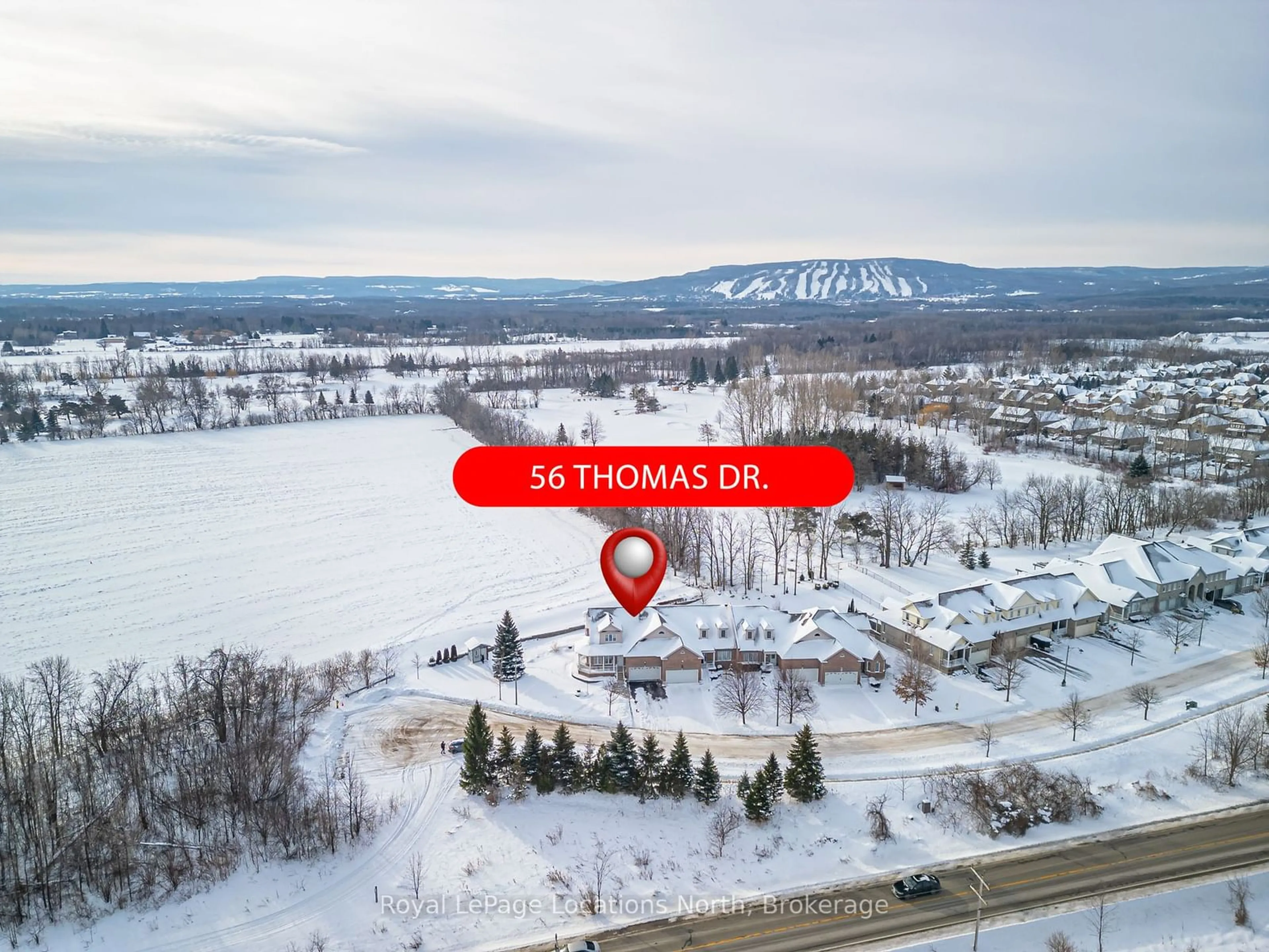 A pic from outside/outdoor area/front of a property/back of a property/a pic from drone, street for 56 Thomas Dr, Collingwood Ontario L9Y 0A6