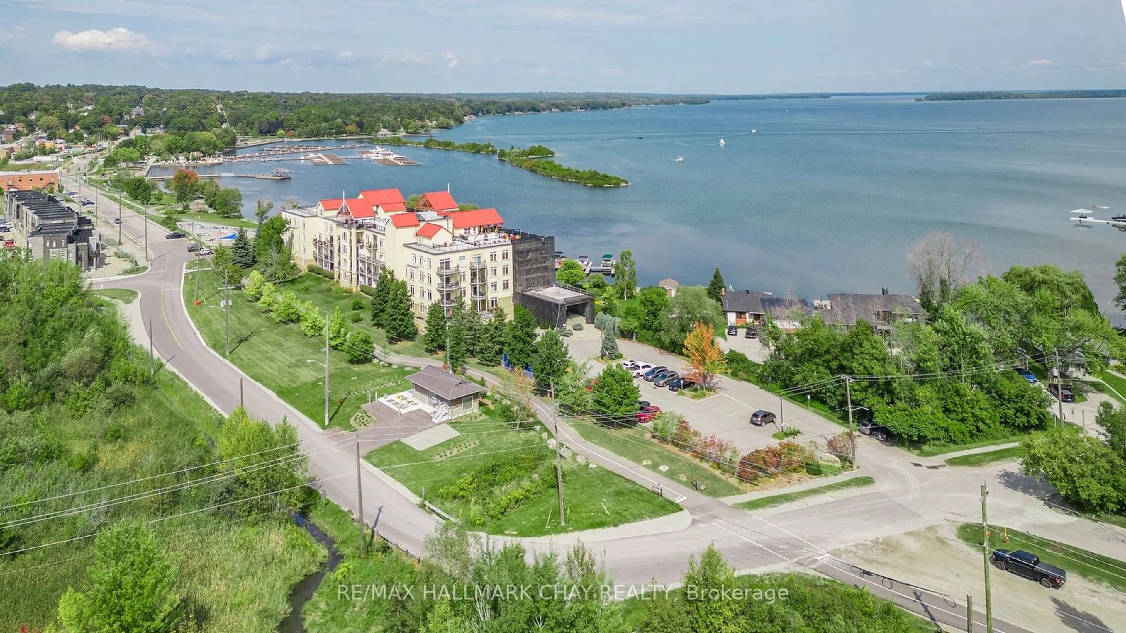 A pic from outside/outdoor area/front of a property/back of a property/a pic from drone, water/lake/river/ocean view for 140 Cedar Island Rd #112, Orillia Ontario L3V 1T1