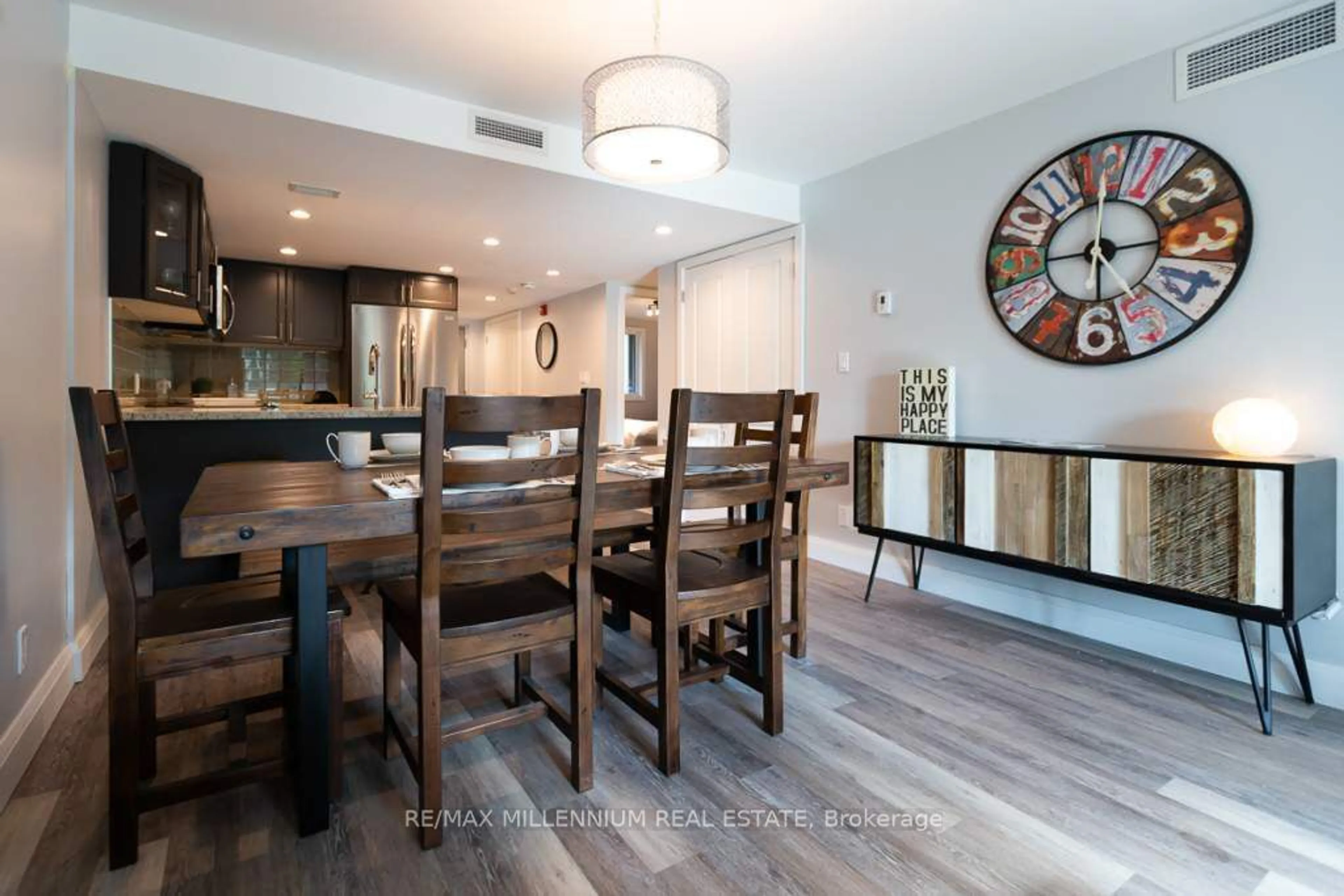 Open concept kitchen, wood/laminate floor for 1101 Horseshoe Valley Rd #8, Oro-Medonte Ontario L4M 4Y8